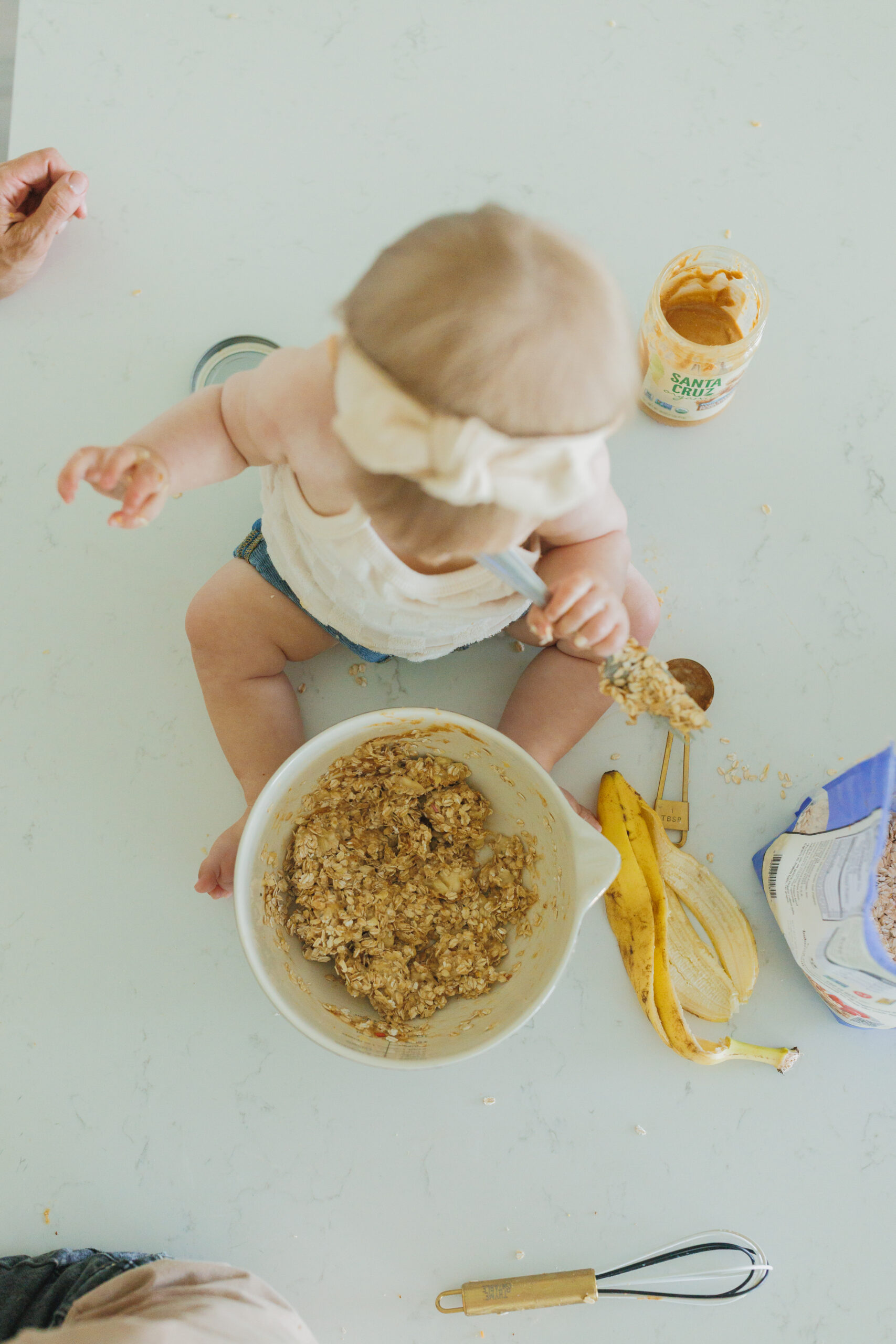 baby helping make peanut butter banana 3 ingredient oatmeal cookies