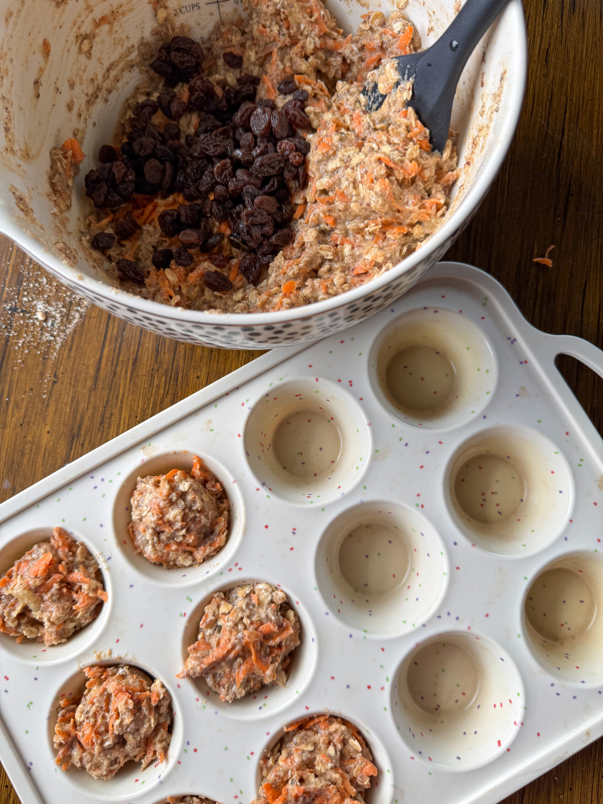 dividing the batter for the morning glory muffins
