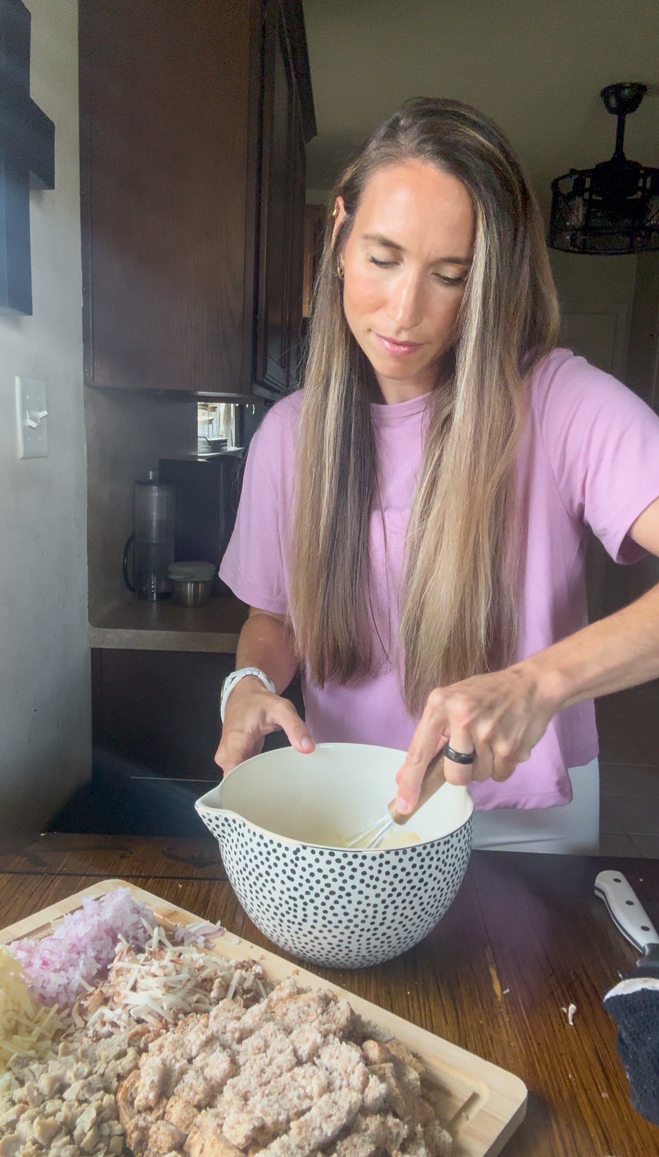 whisking eggs and milk for savory breakfast muffins