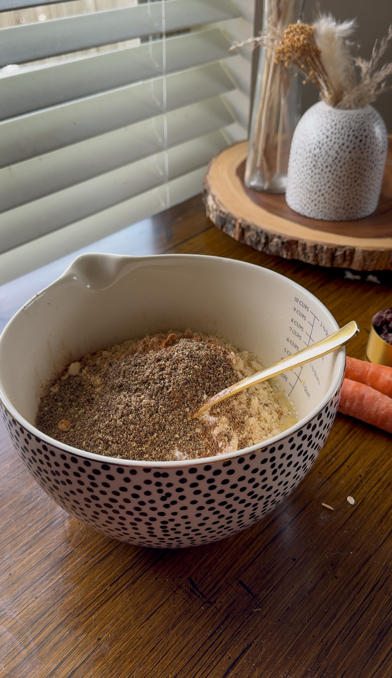 mixing all the ingredients for morning glory muffins