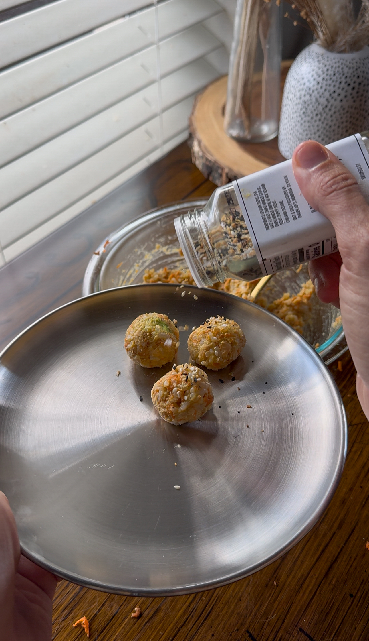 shaking sesame seeds on top