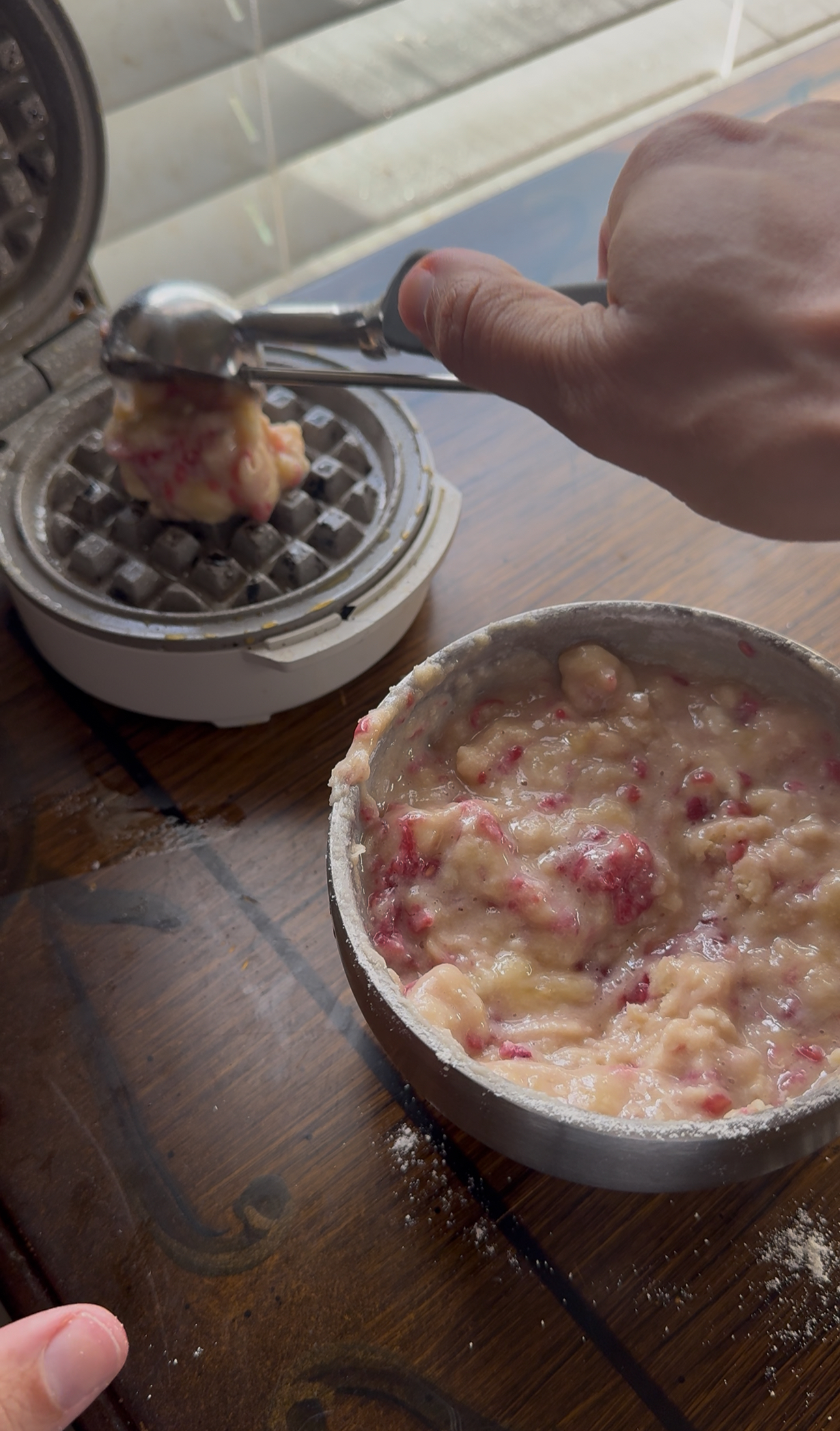 pouring the batter into iron
