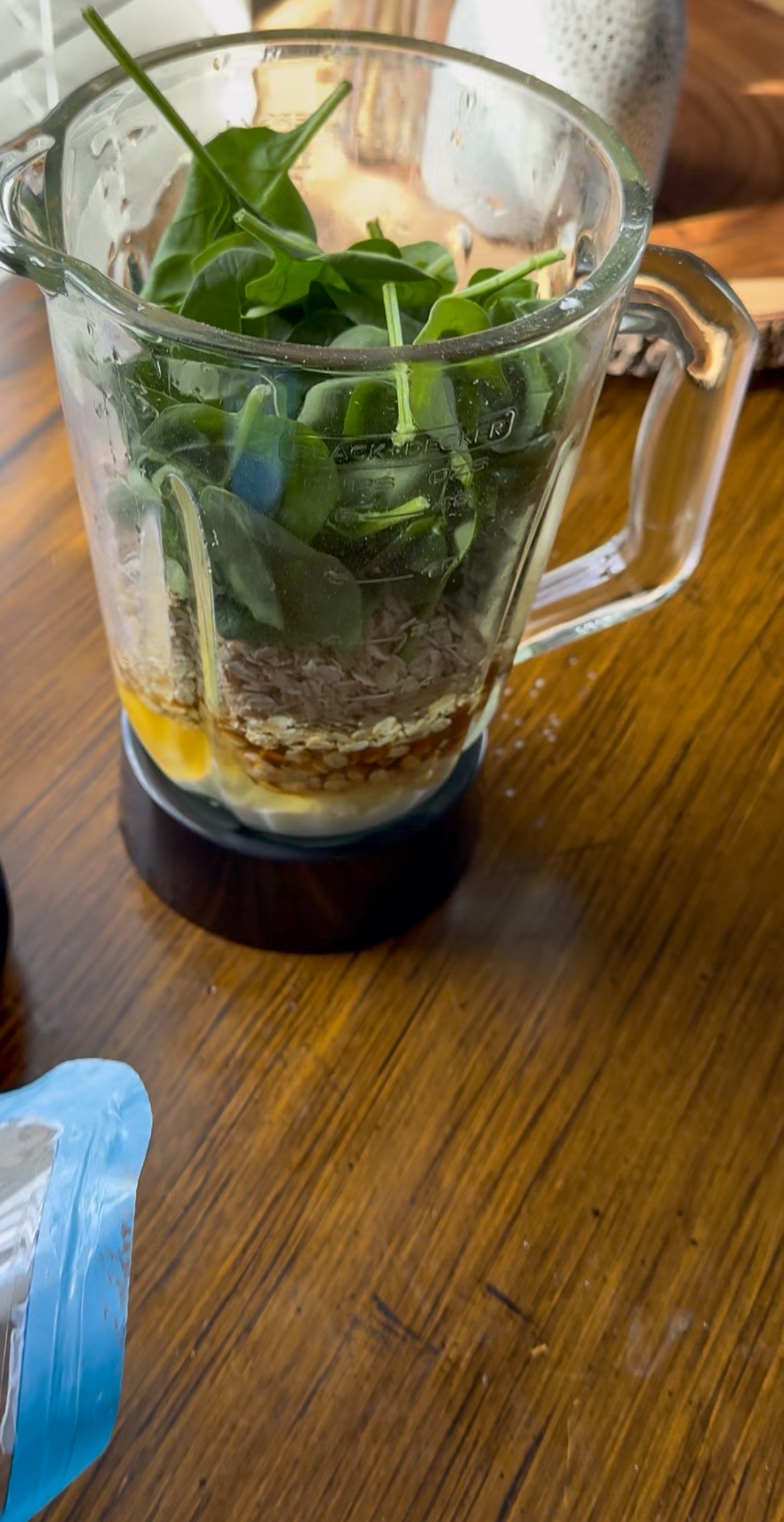 adding ingredients to blender for muffins