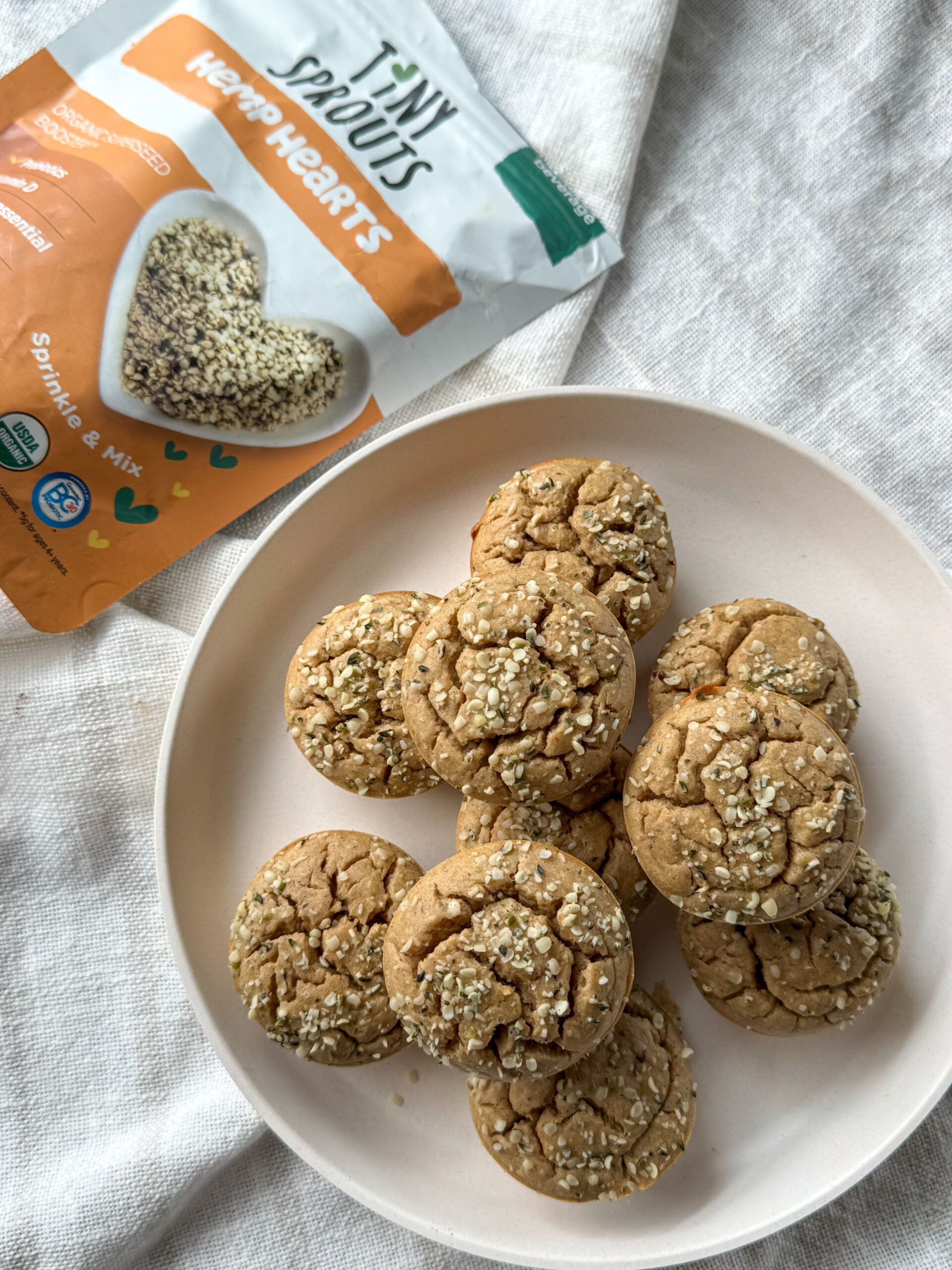 banana chickpea muffins with hemp hearts sprinkles on top
