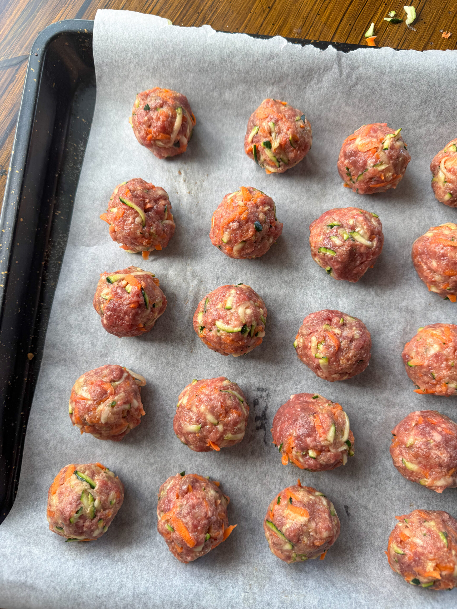 formed balls on a baking sheet waiting to be baked