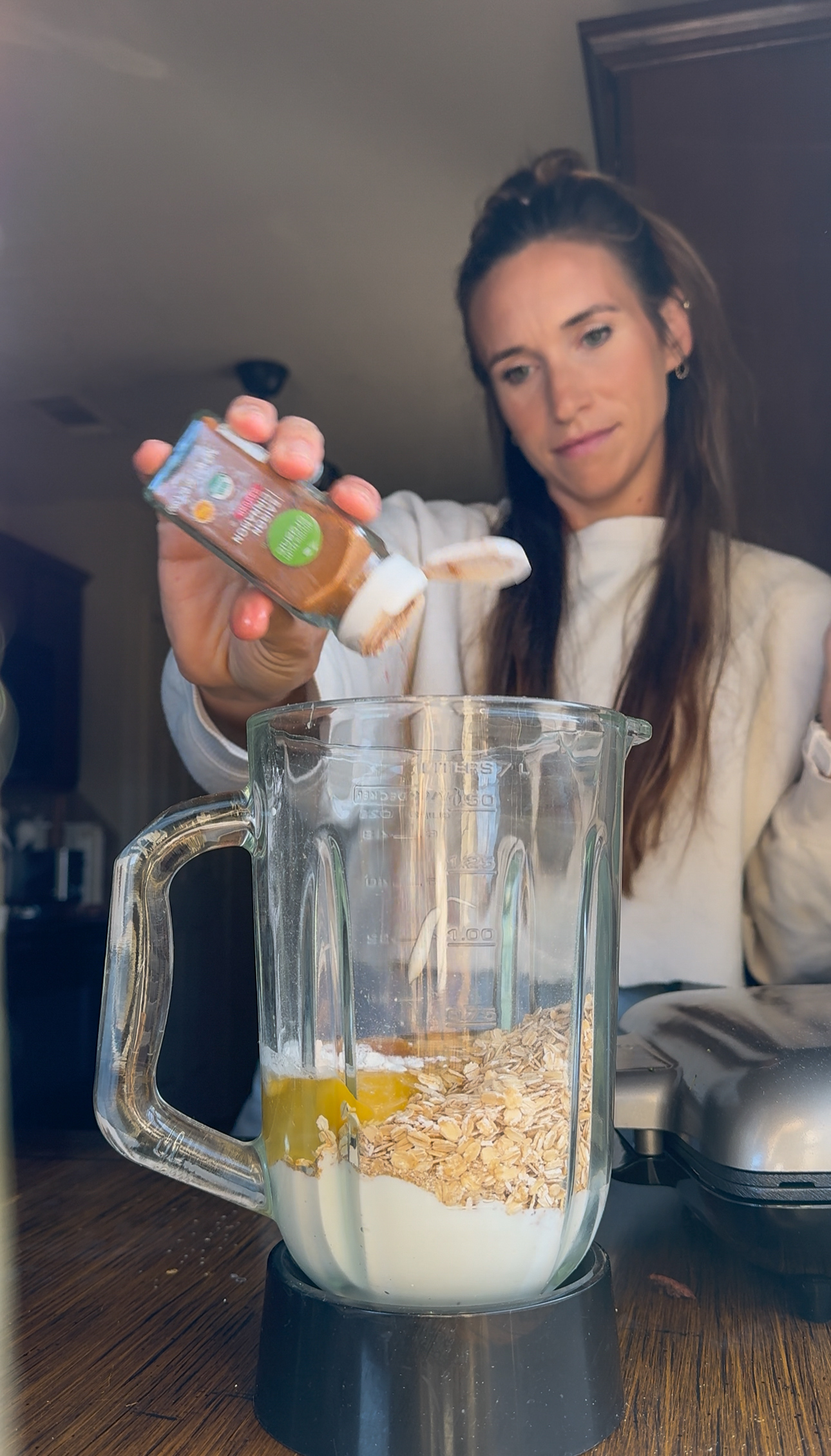 adding the ingredients into blender