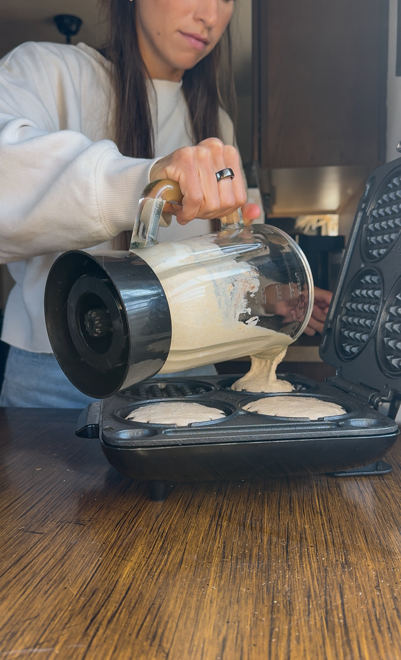 pouring the batter into waffle maker