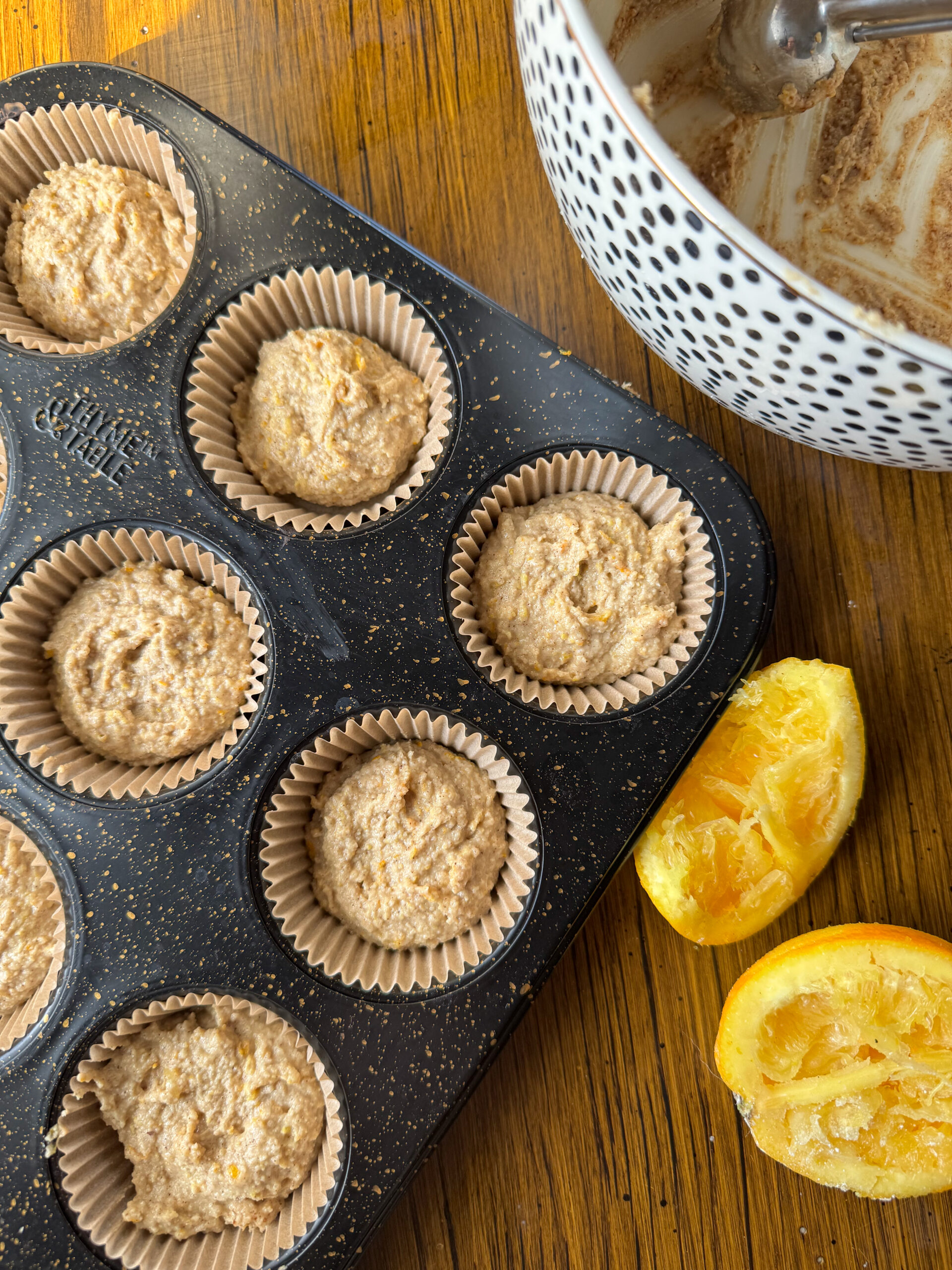 batter divided into the muffin tin