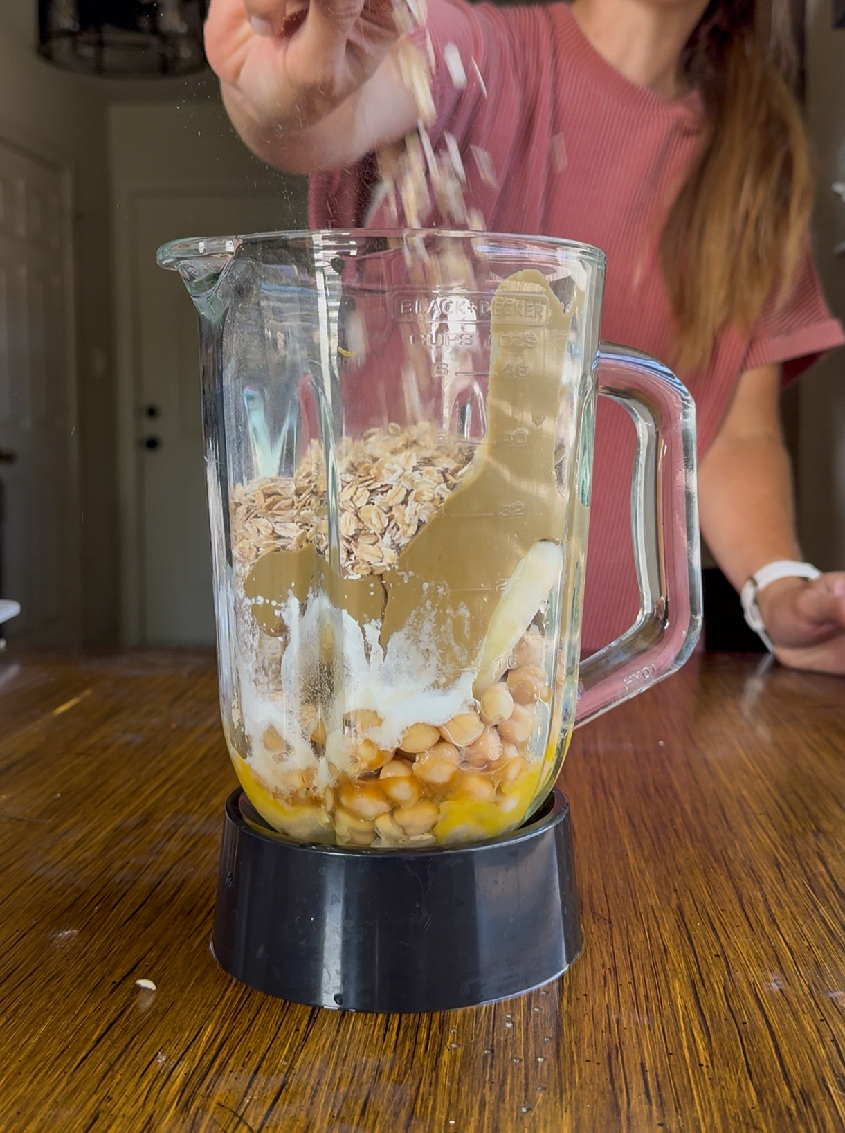 blending the banana chickpea muffin ingredients together in a blender