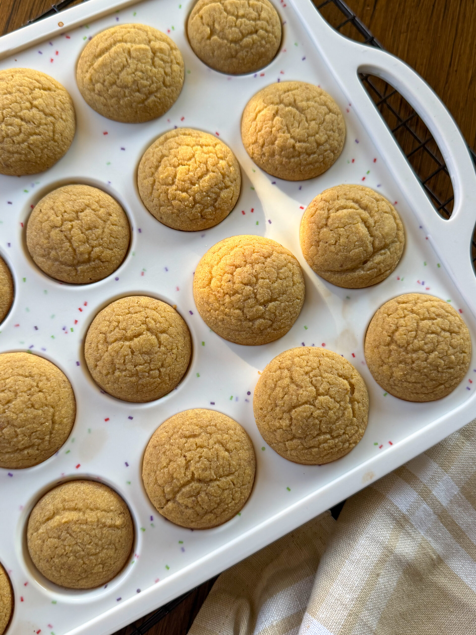 finished cornbread chickpea muffins for toddlers in a white mini muffin pan