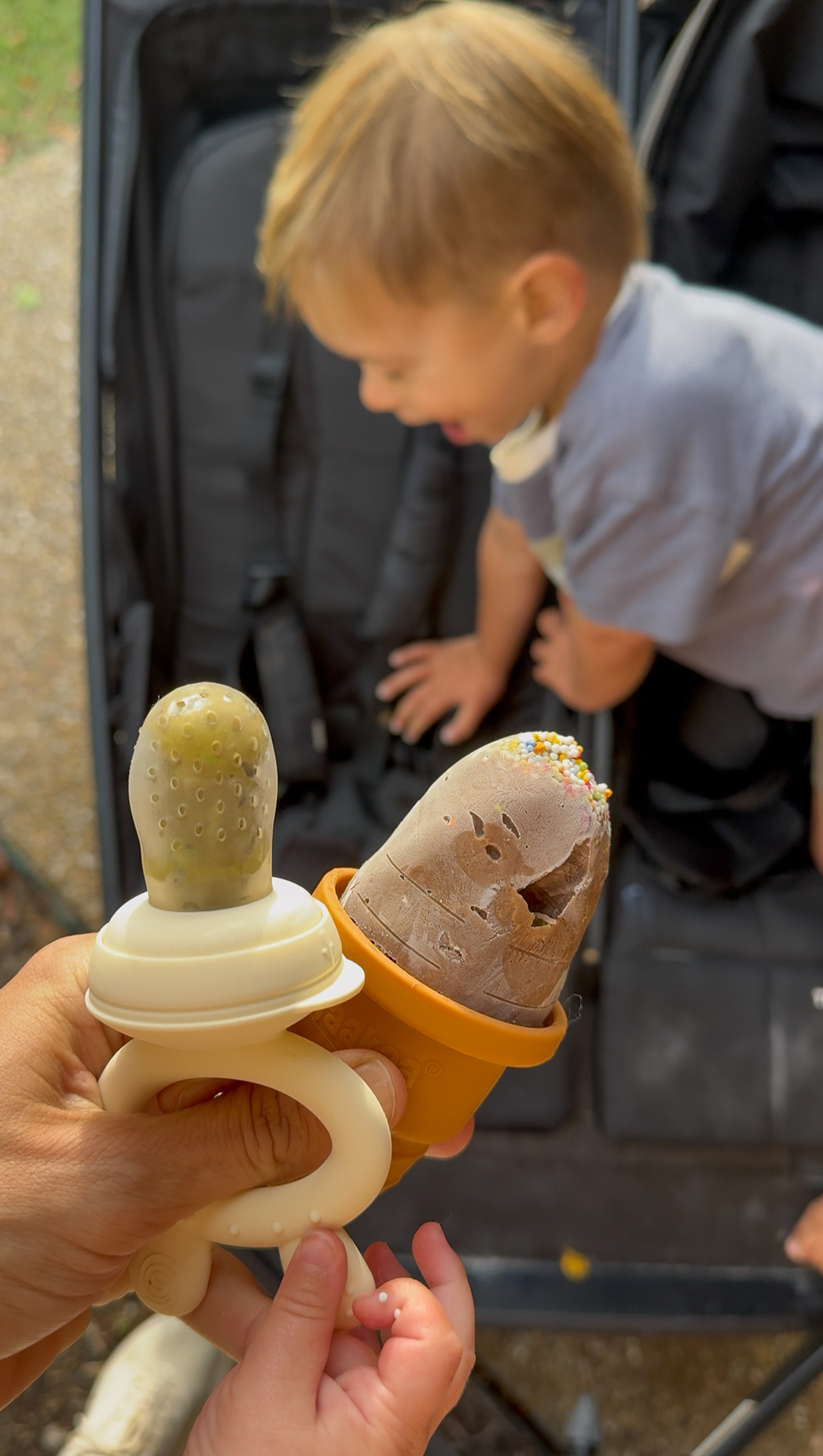 banana avocado smoothie pops serving to toddler