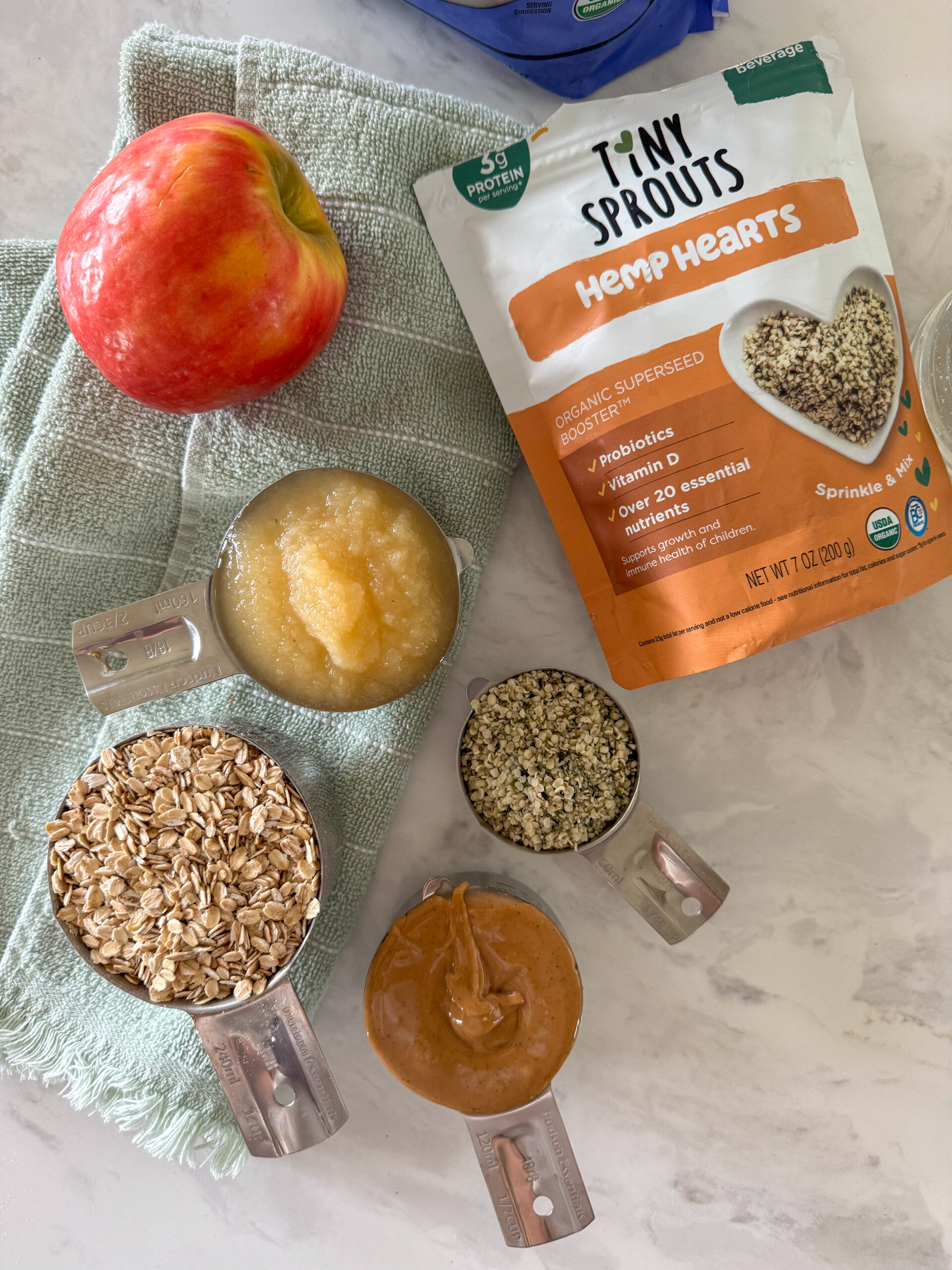 oats, hemp hearts, peanut butter, applesauce, and apple for the oatmeal cookies