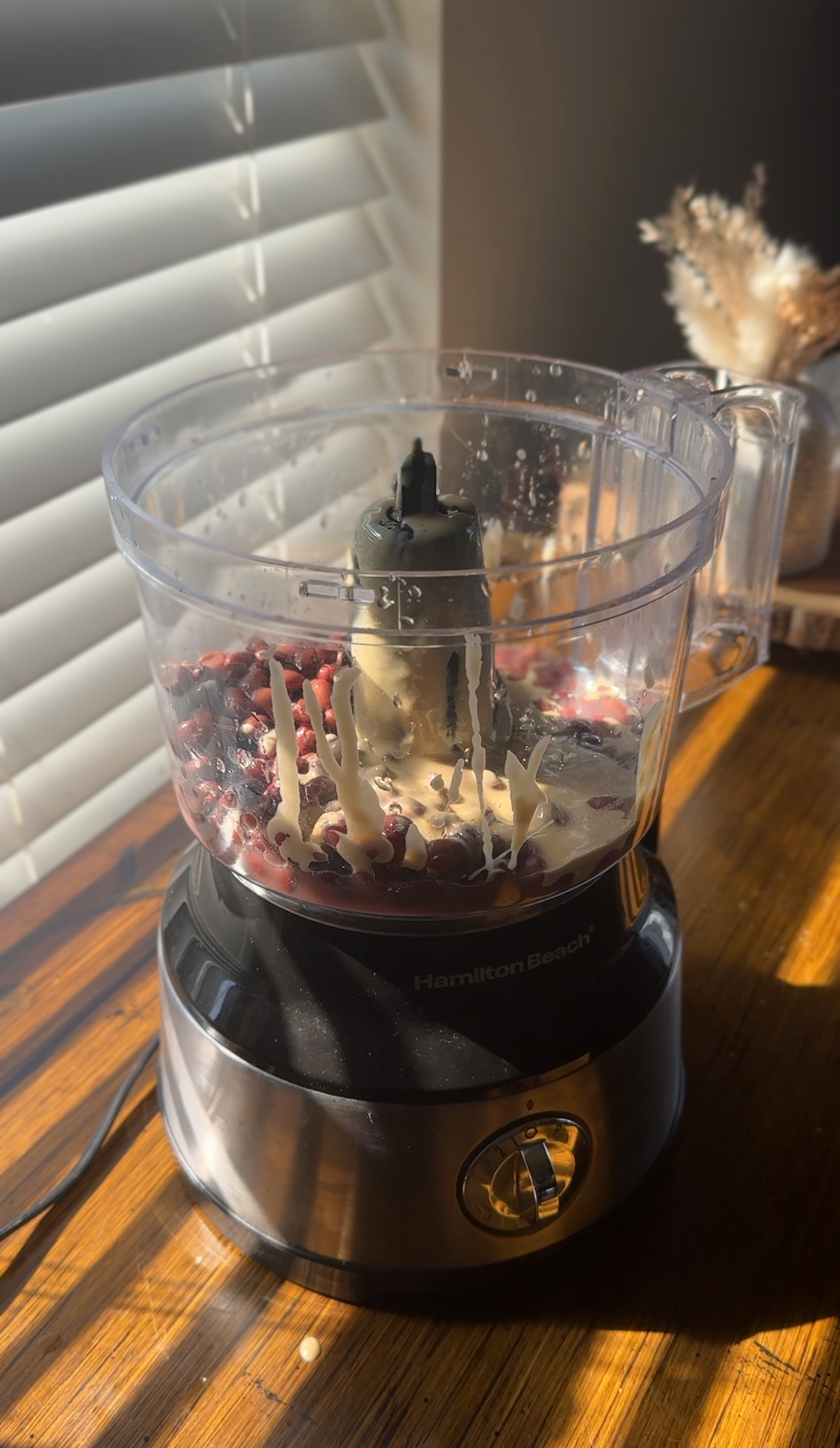 adding ingredients into the food processor
