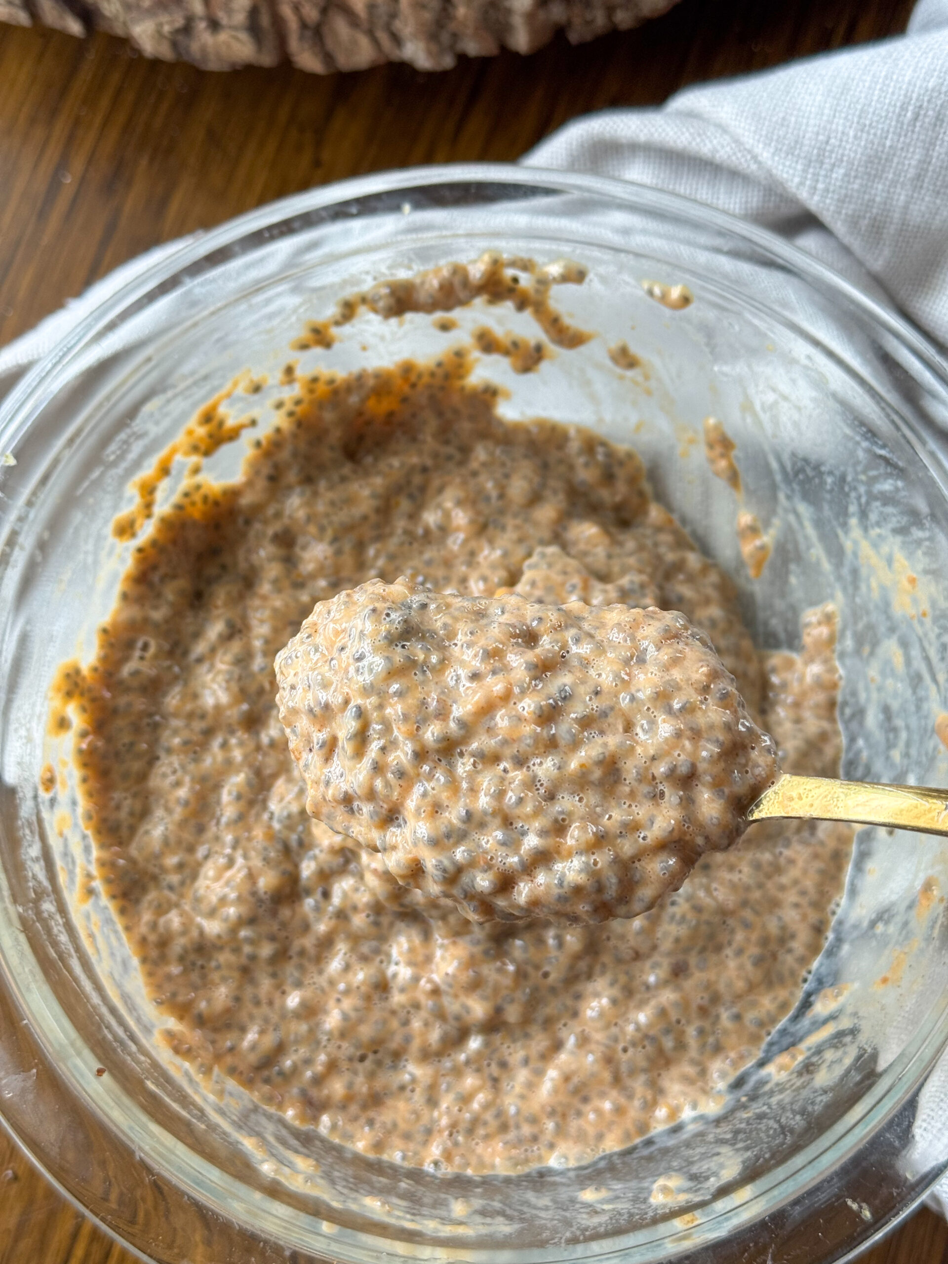 pumpkin chia pudding being mixed again before serving