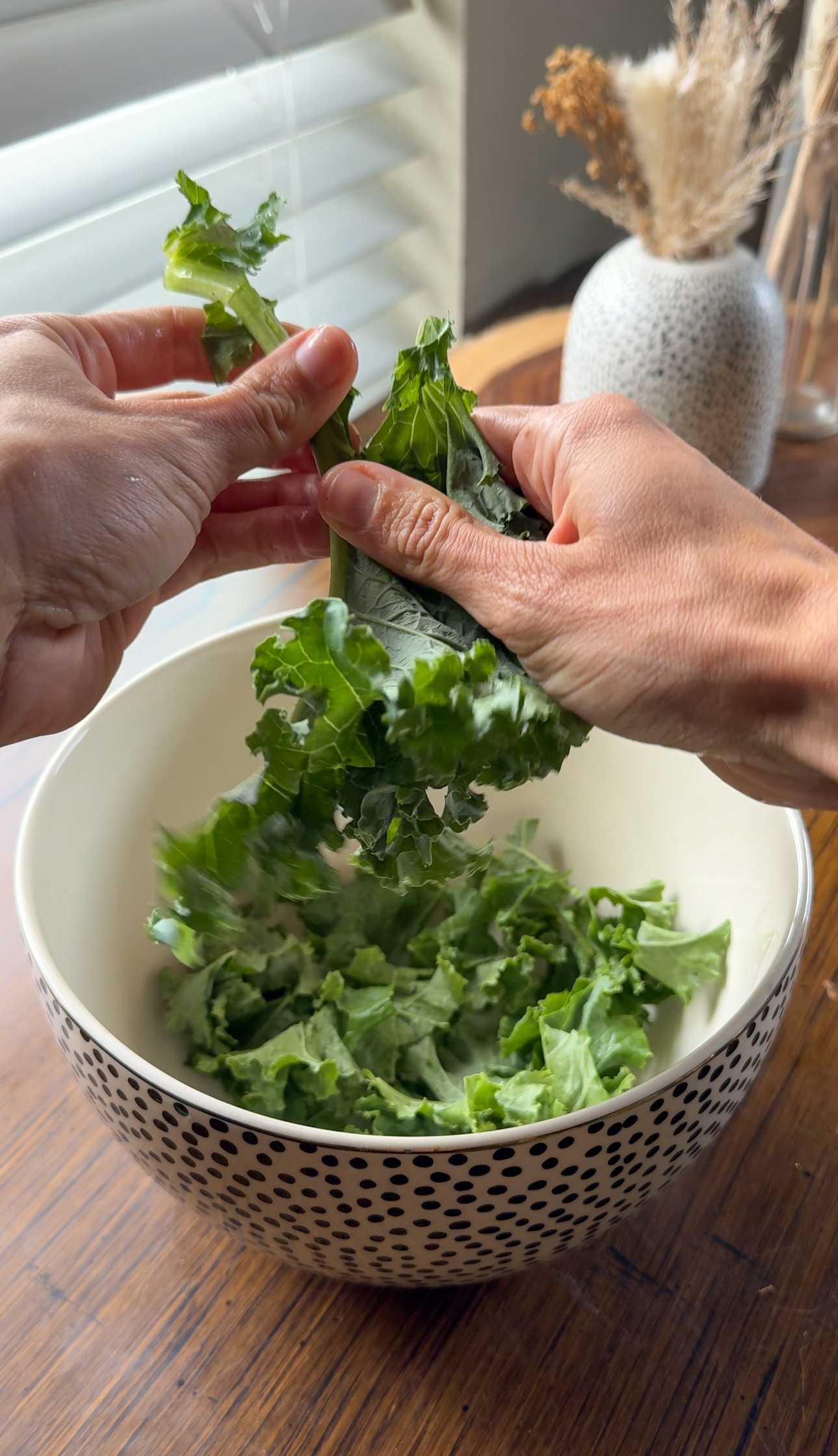 tearing off the kale leaves