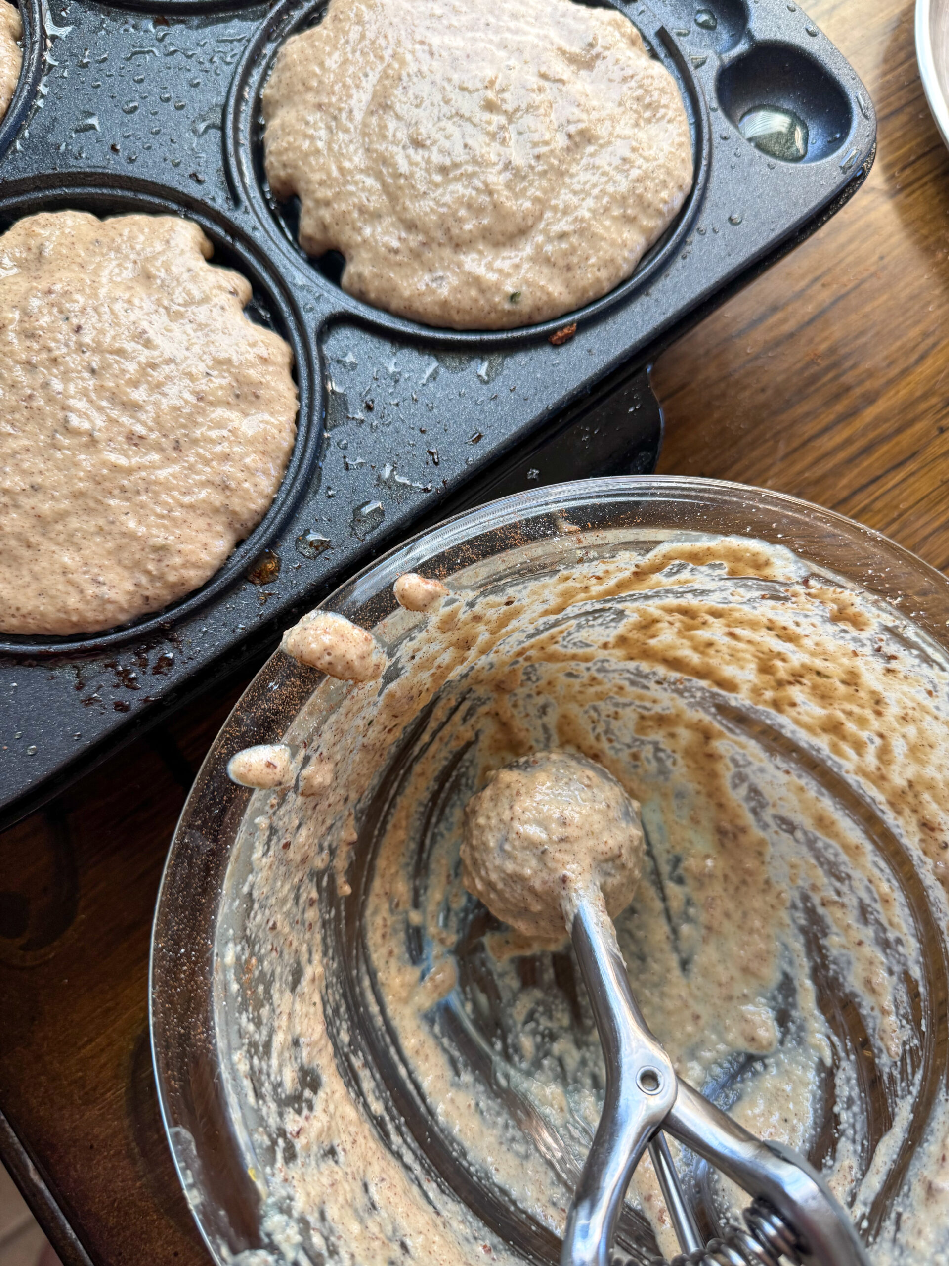 pouring apple cinnamon oatmeal waffle batter into the waffle maker