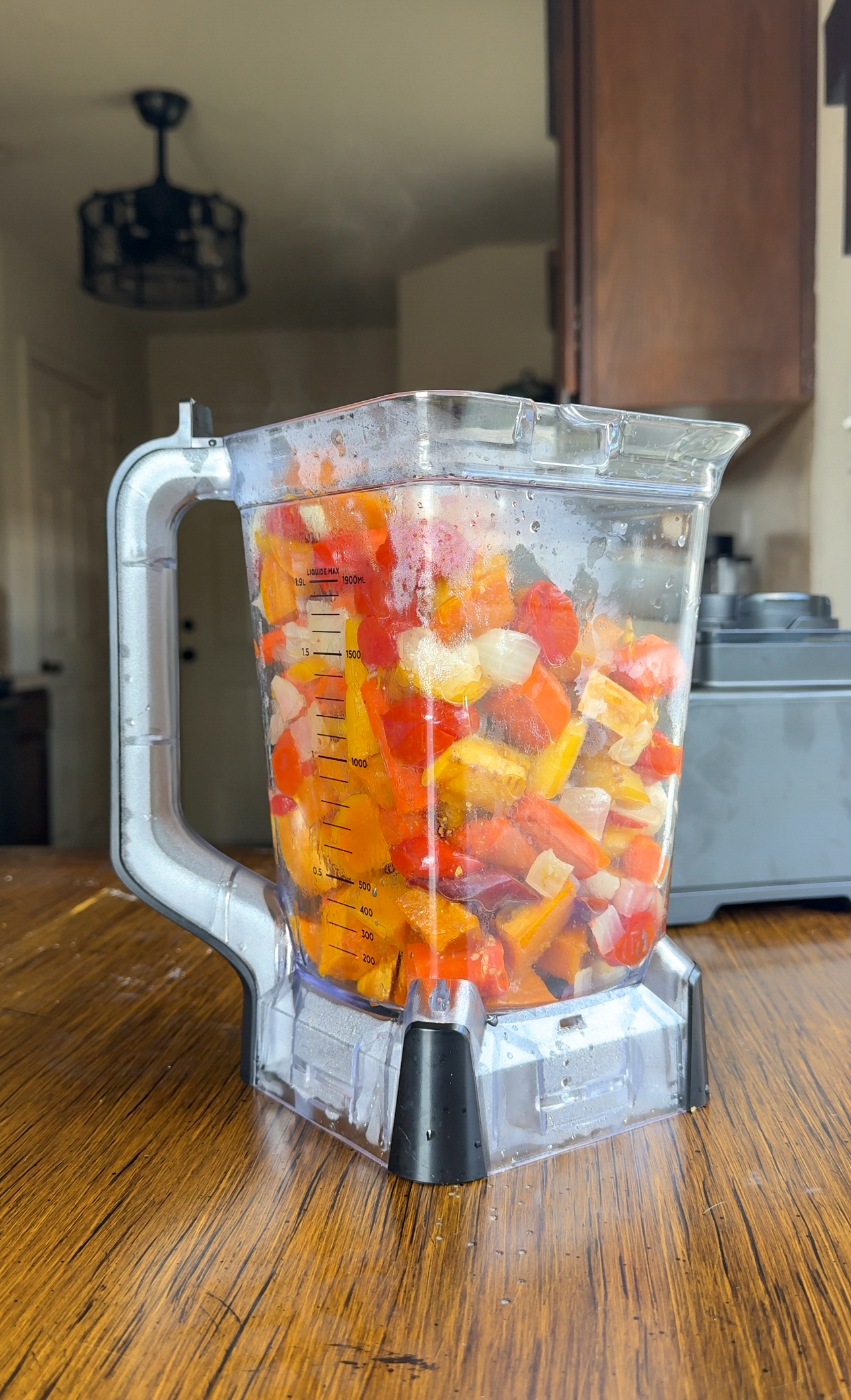 adding the vegetables to the blender