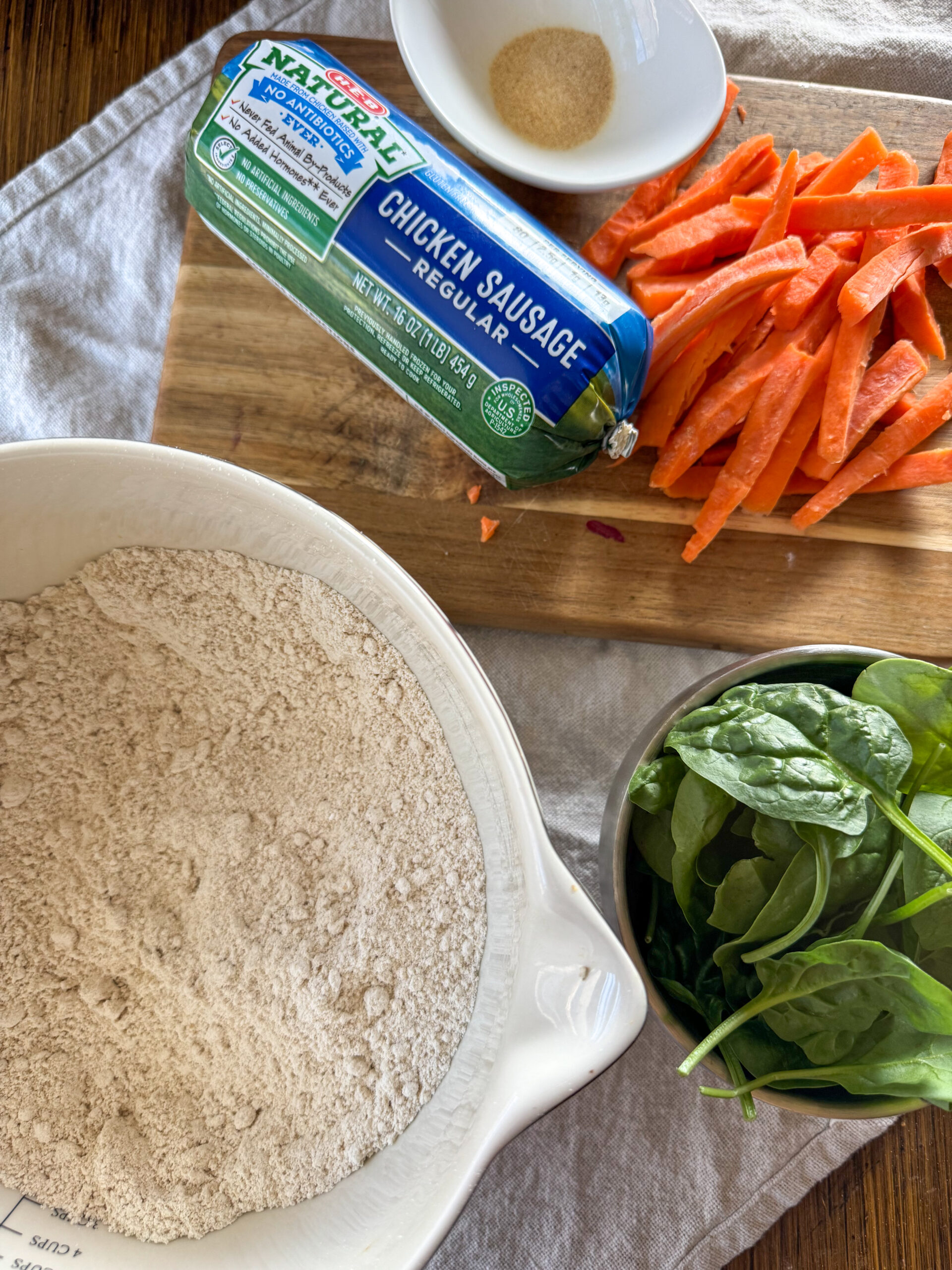 chicken sausage, carrots, spinach, and yogurt dough ingredients laying out