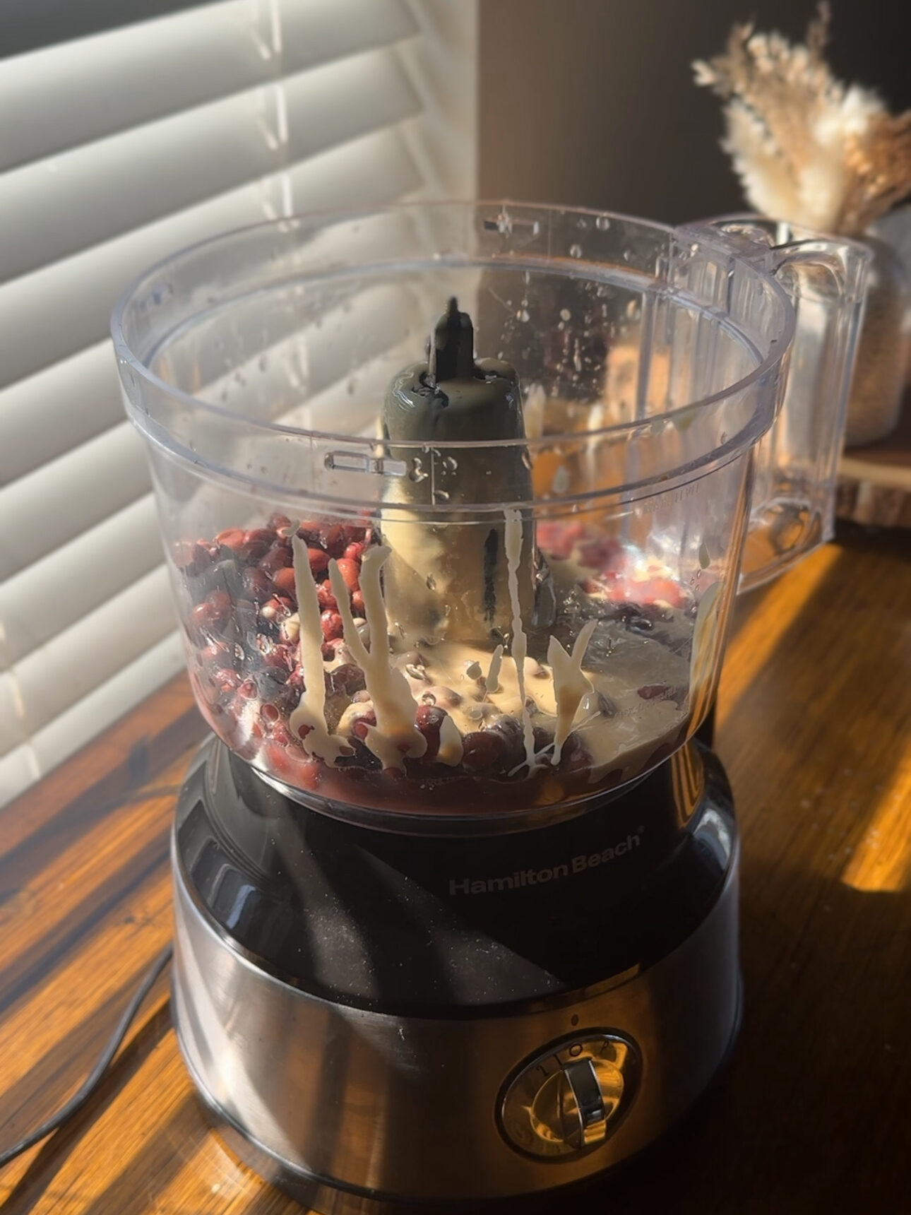 adding ingredients into the food processor