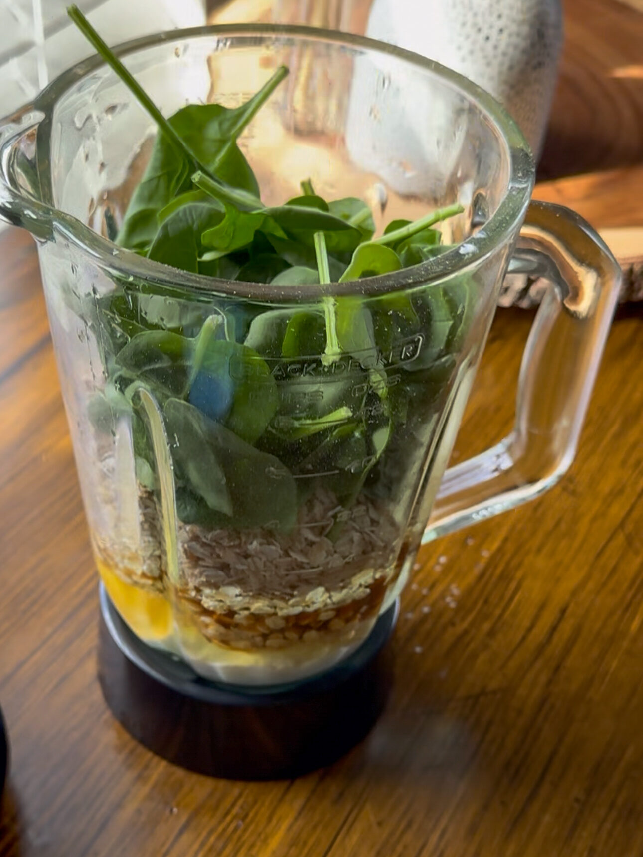 adding ingredients to blender for muffins