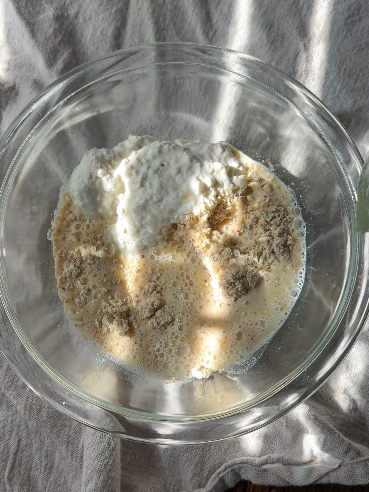 mixing the cottage cheese protein pancake ingredients in a bowl