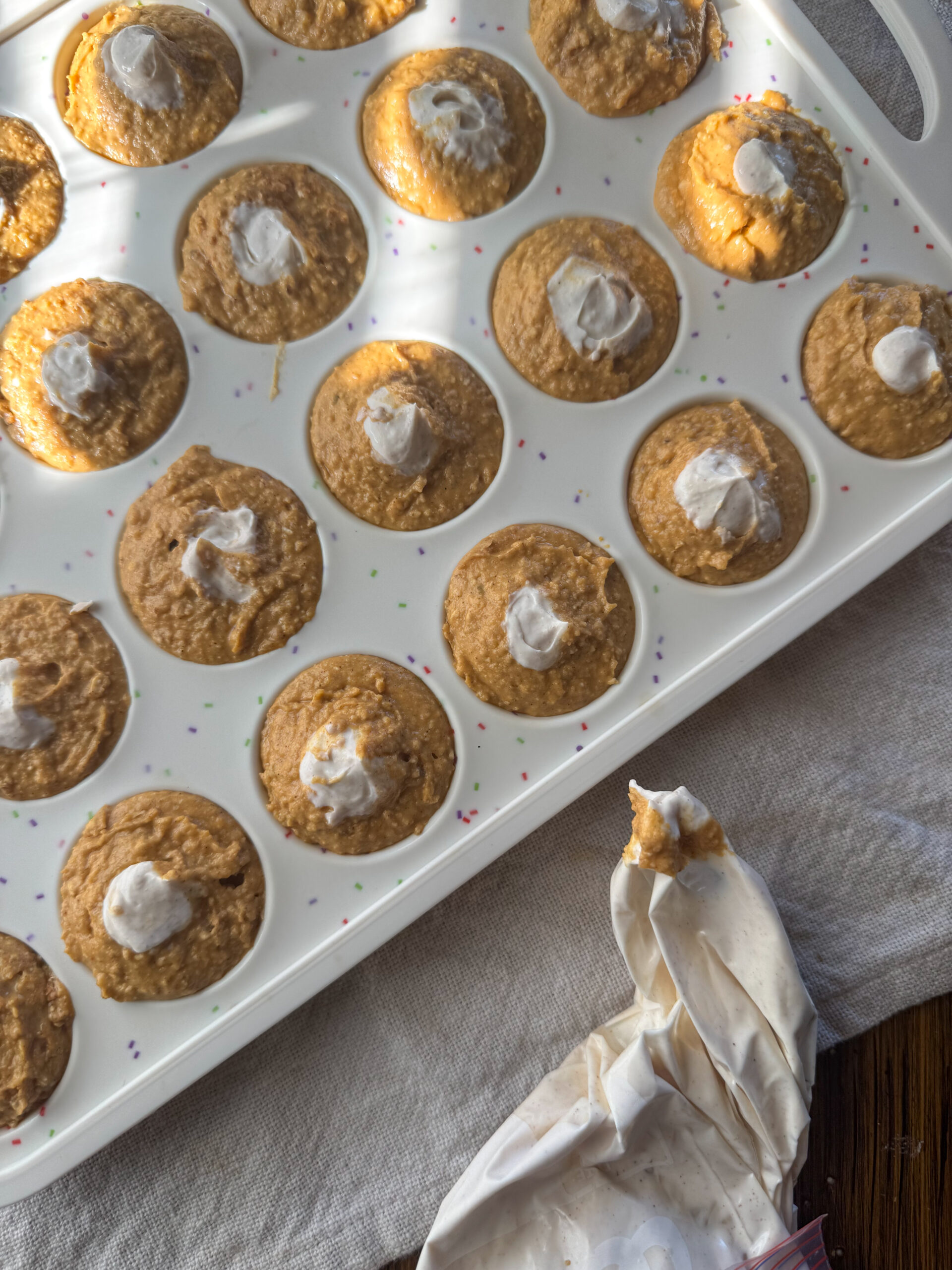 pumpkin cream cheese chickpea muffins about to be baked