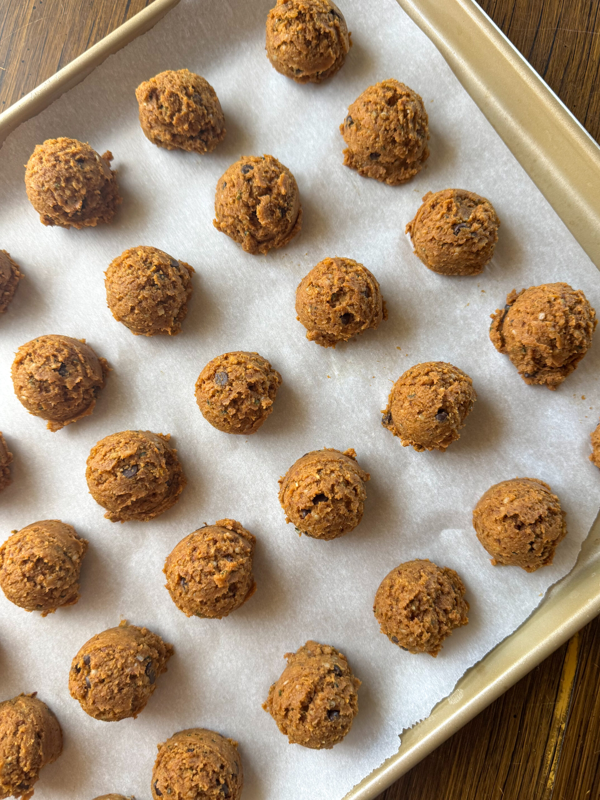 rolling the dough into balls to bake