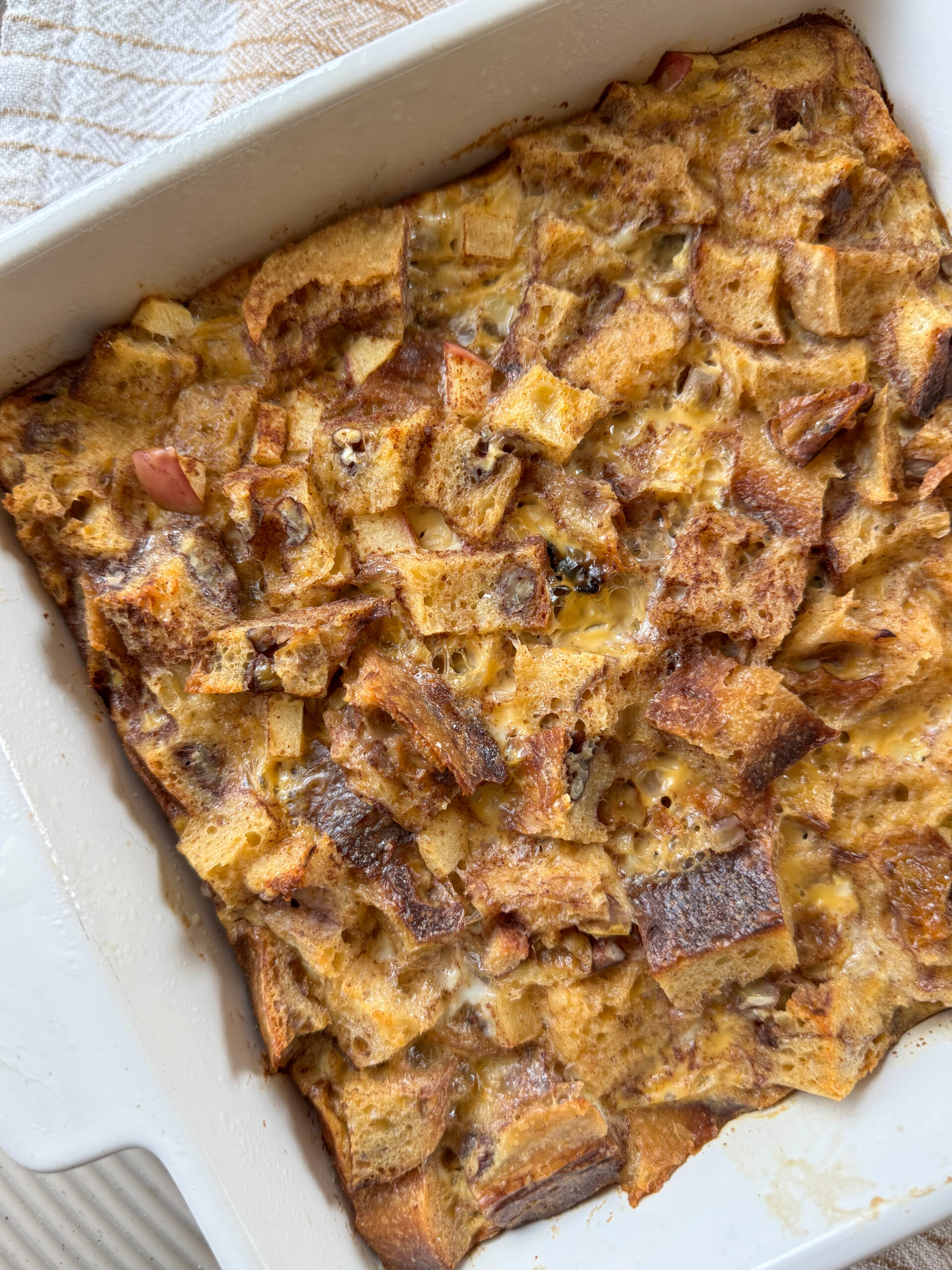 finished apple cinnamon french toast bake in baking dish