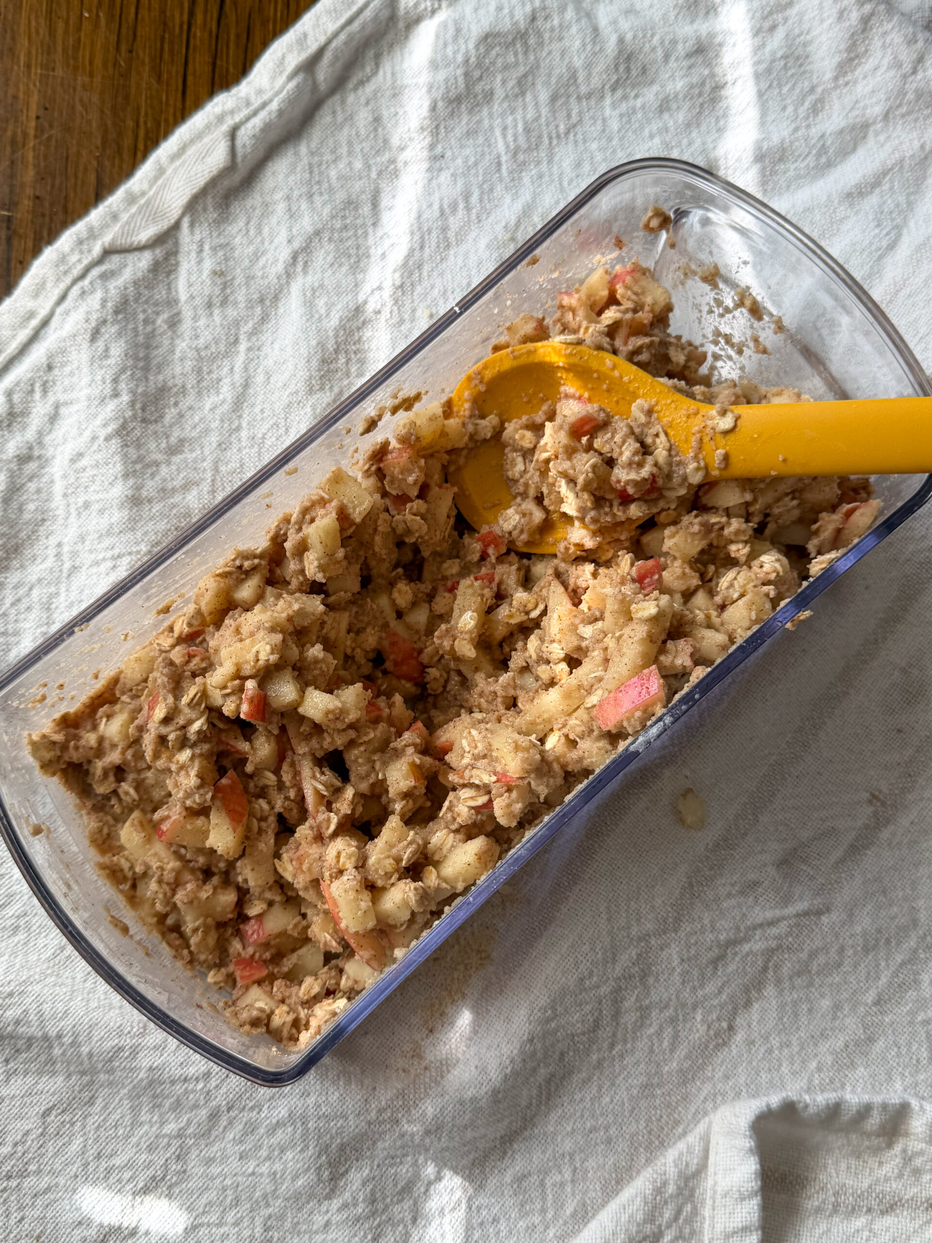 mixing ingredients for healthy baked apple fritters together