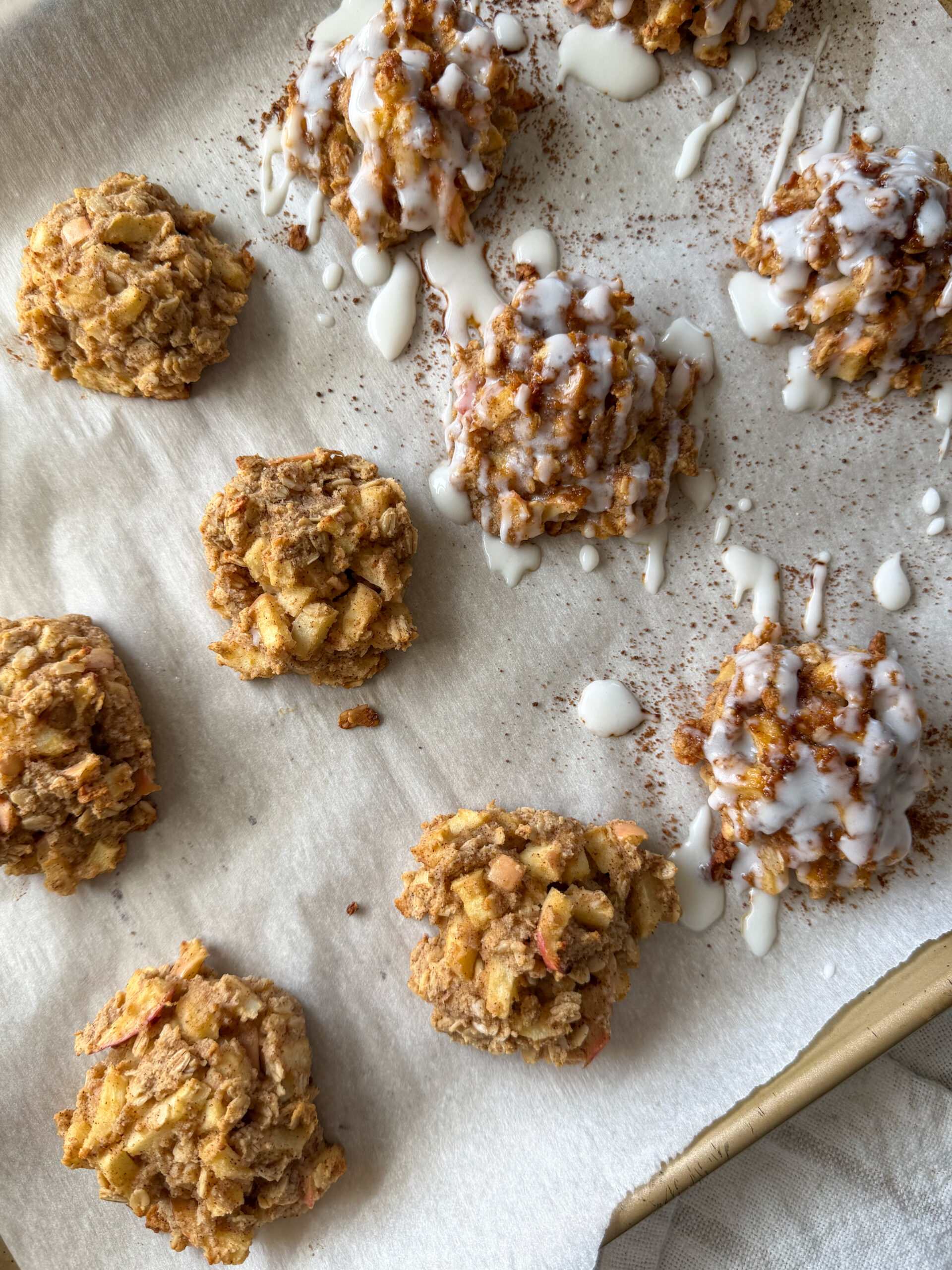 healthy baked apple fritters with icing drizzle on top