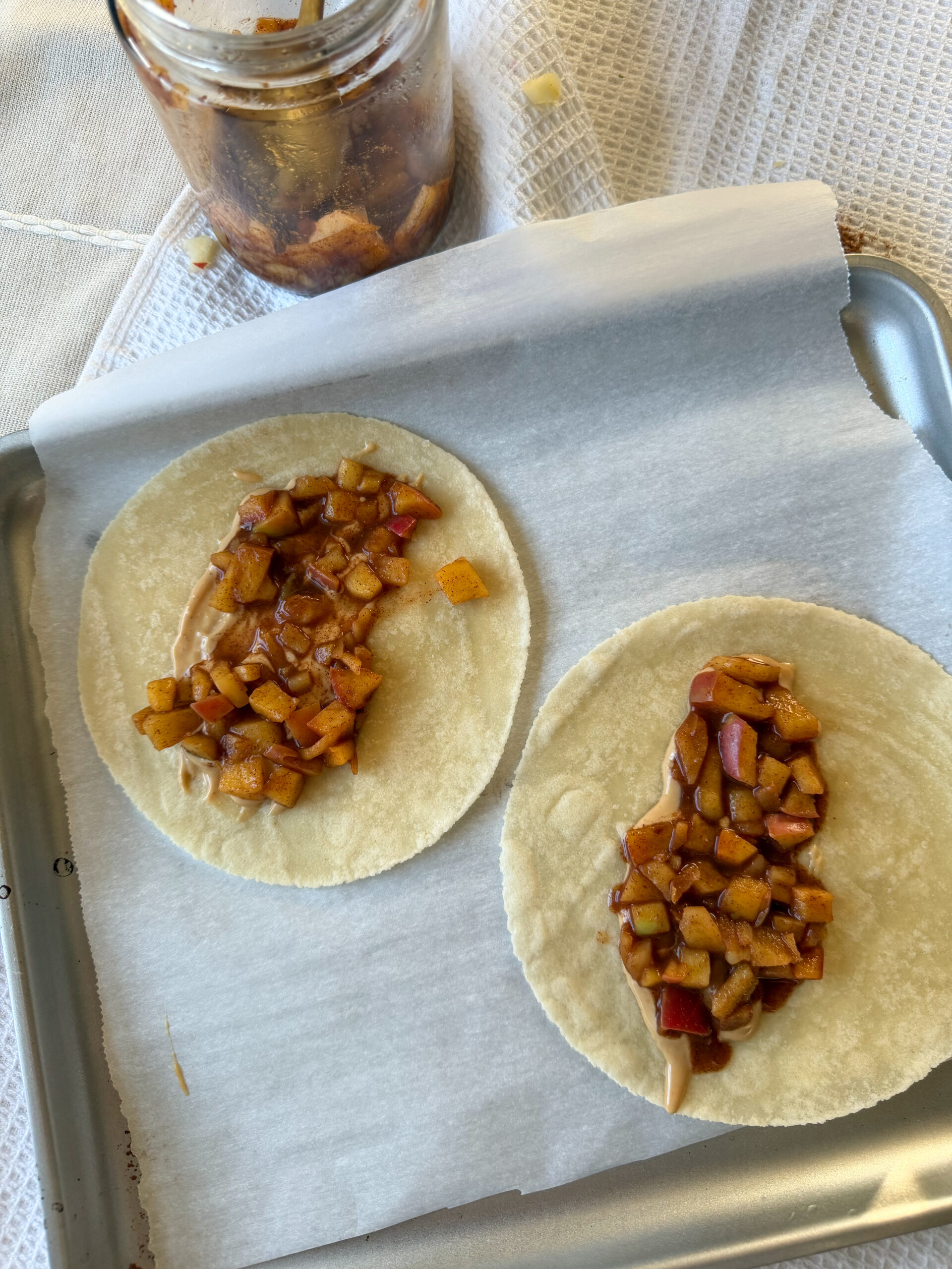 filling the tortillas with the apple pie filling