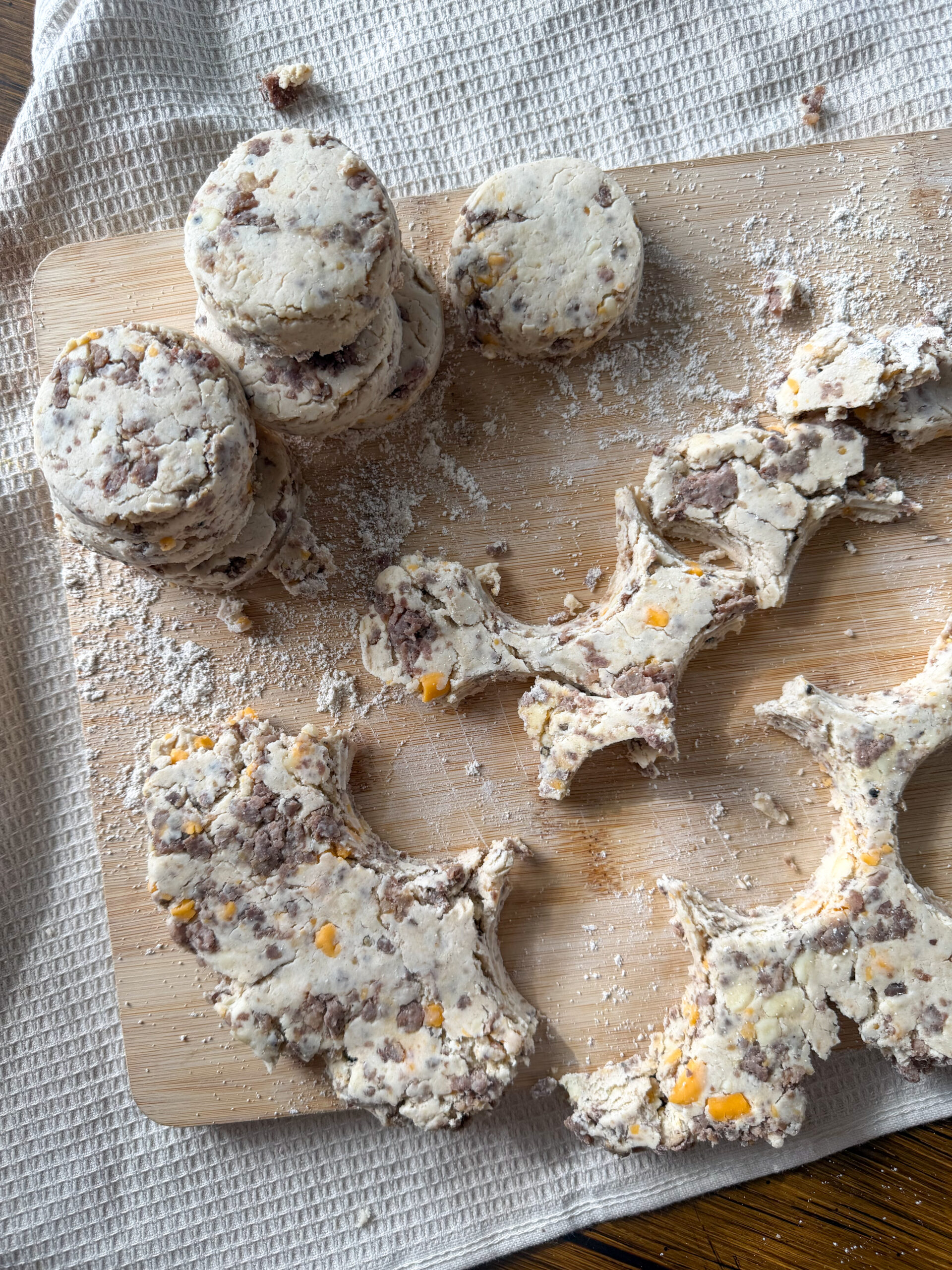 cutting out the Easy Sausage Cheddar Biscuits 