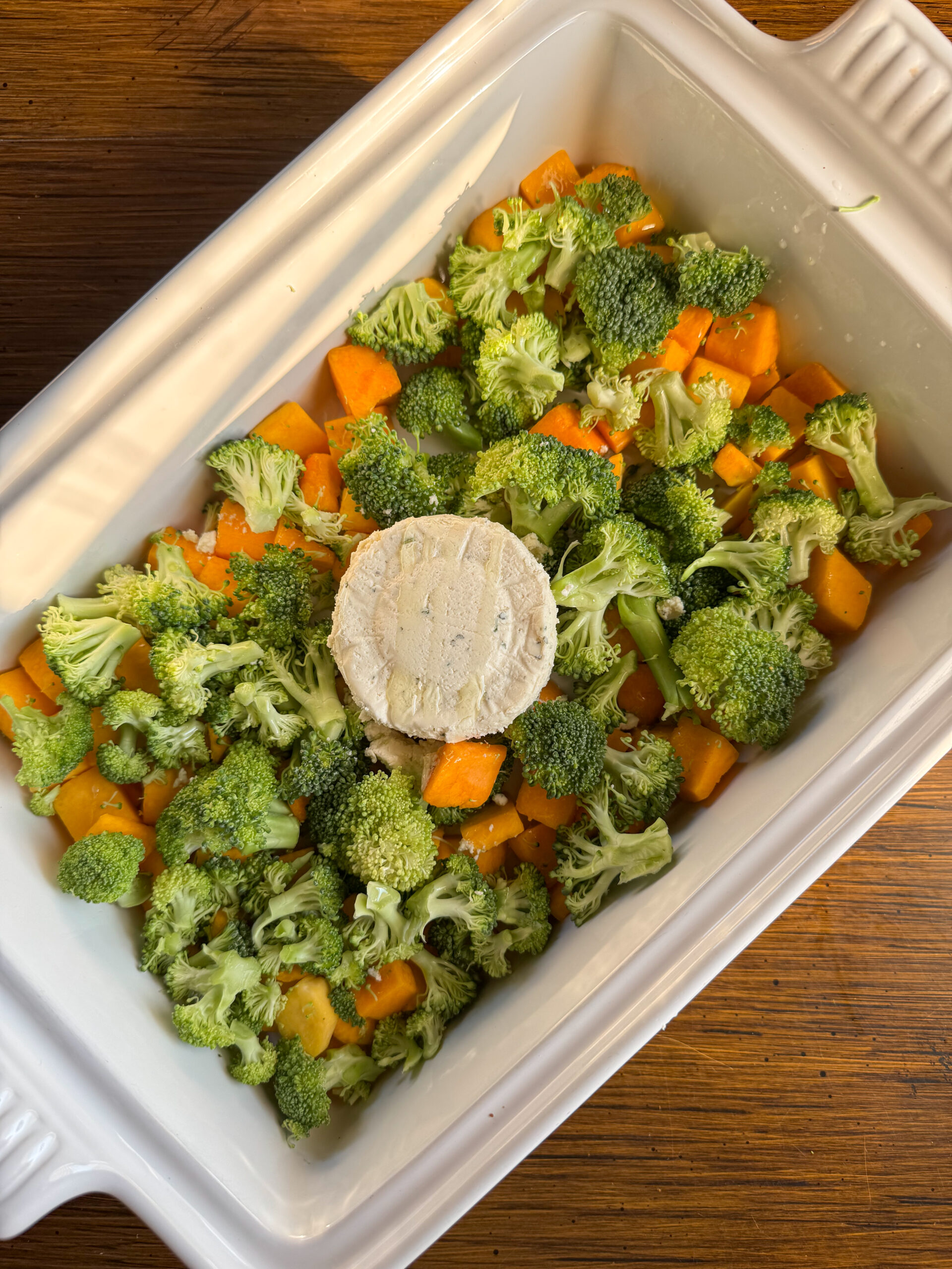 butternut squash, broccoli, and boursin cheese in the baking dish