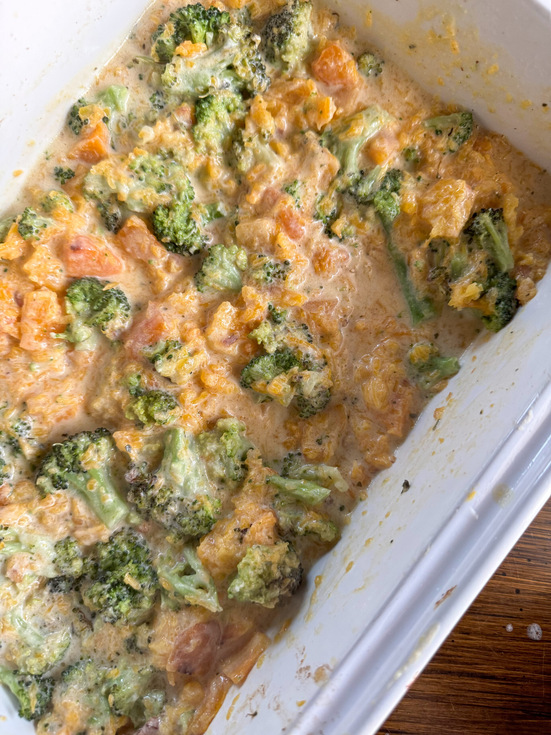 mashing the butternut squash, broccoli, and boursin cheese together for the sauce