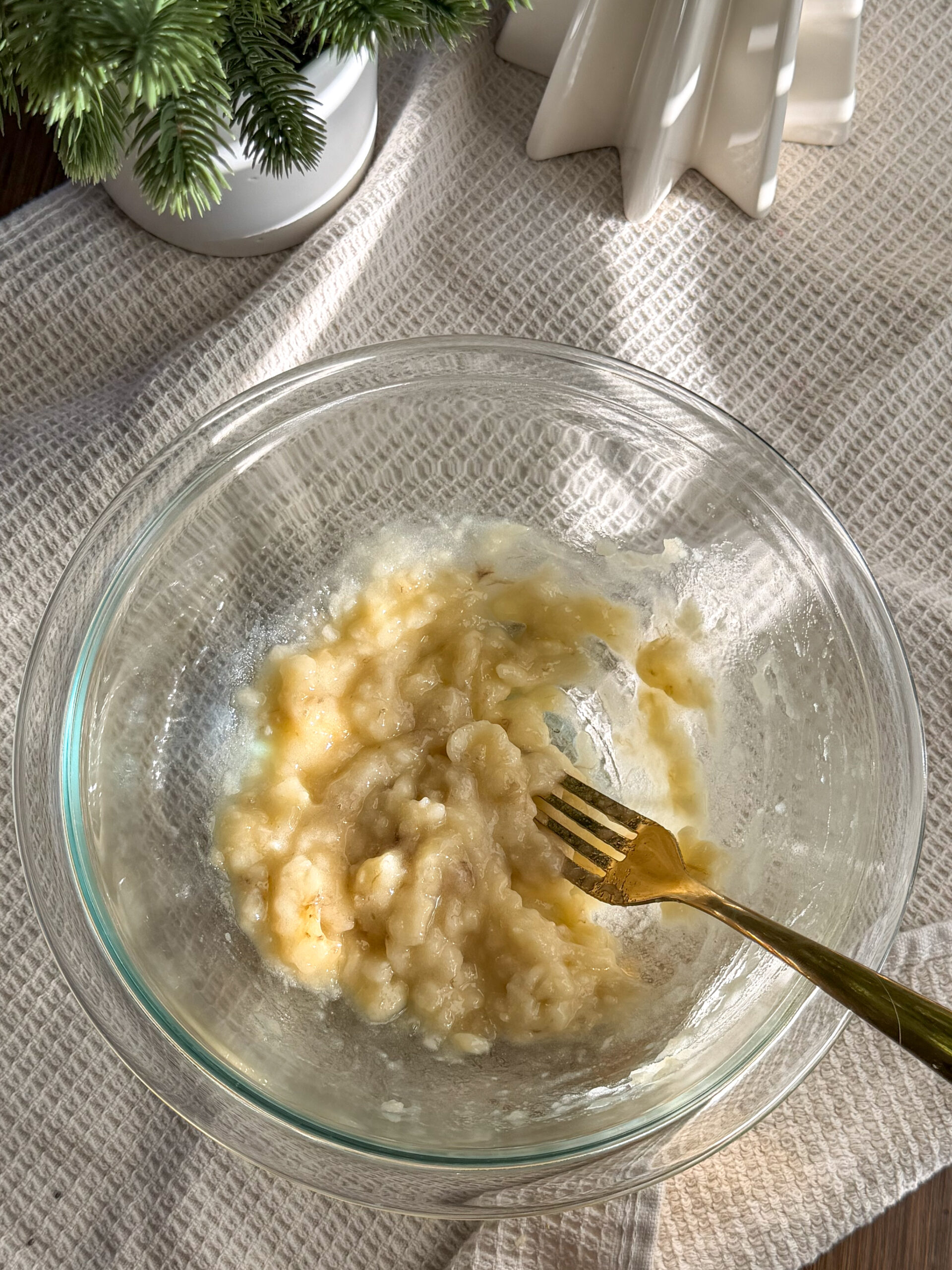 mashing a banana in a bowl