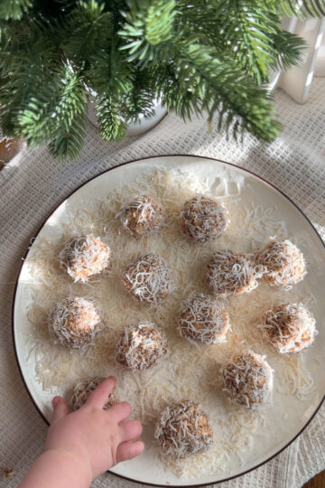 baby hand reaching for banana energy bite