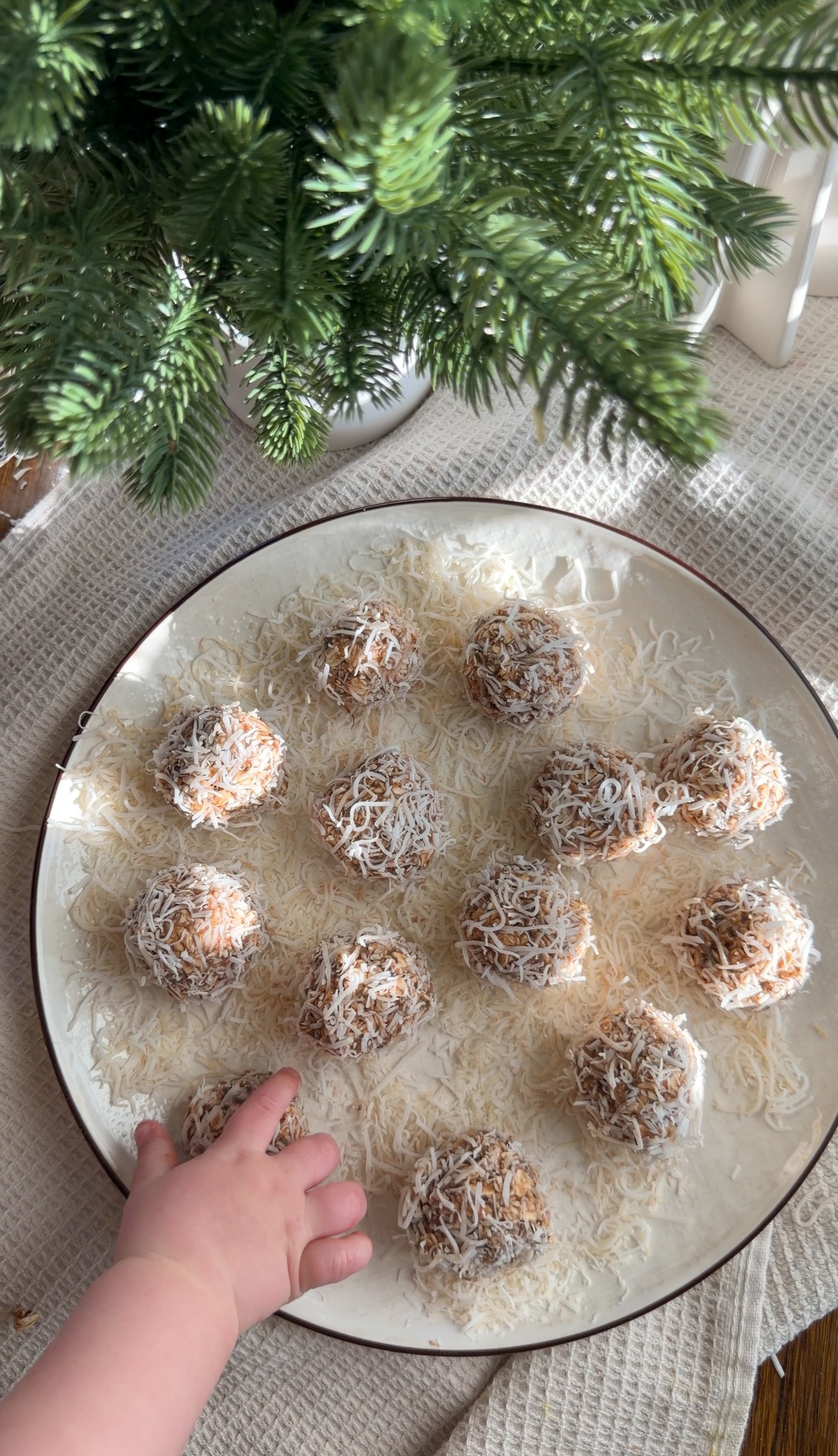 baby hand reaching for banana energy bite