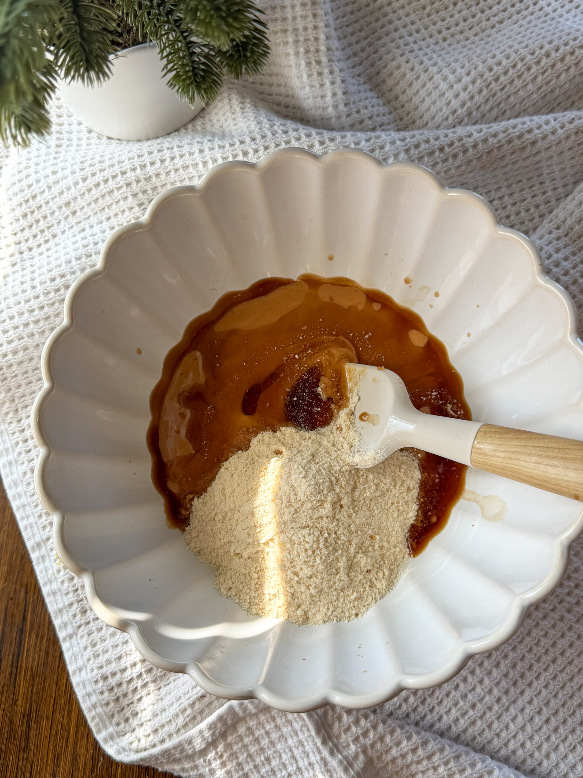 adding the ingredients into white bowl