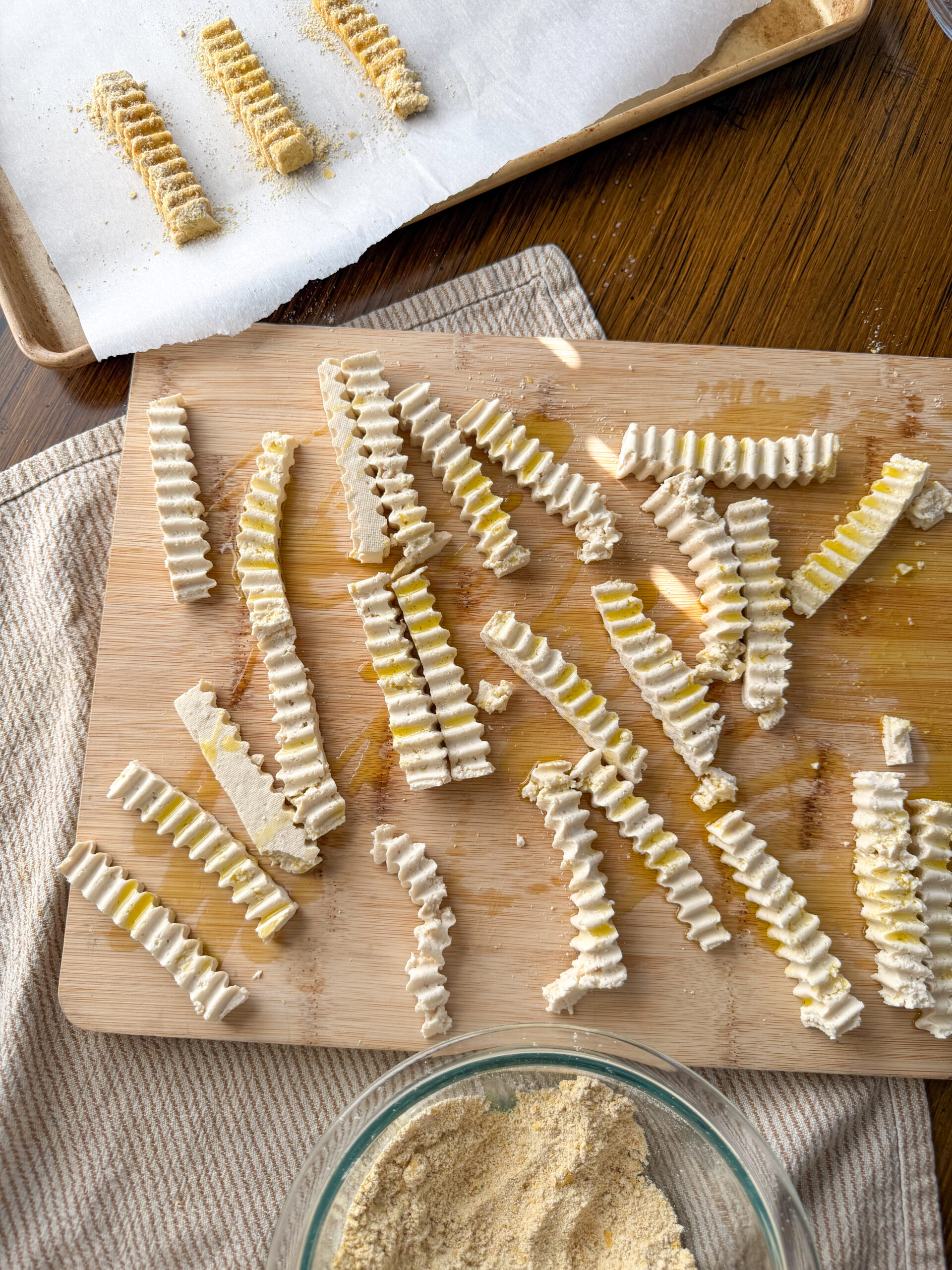 tossing in olive oil and coating in flour with nutritional yeast