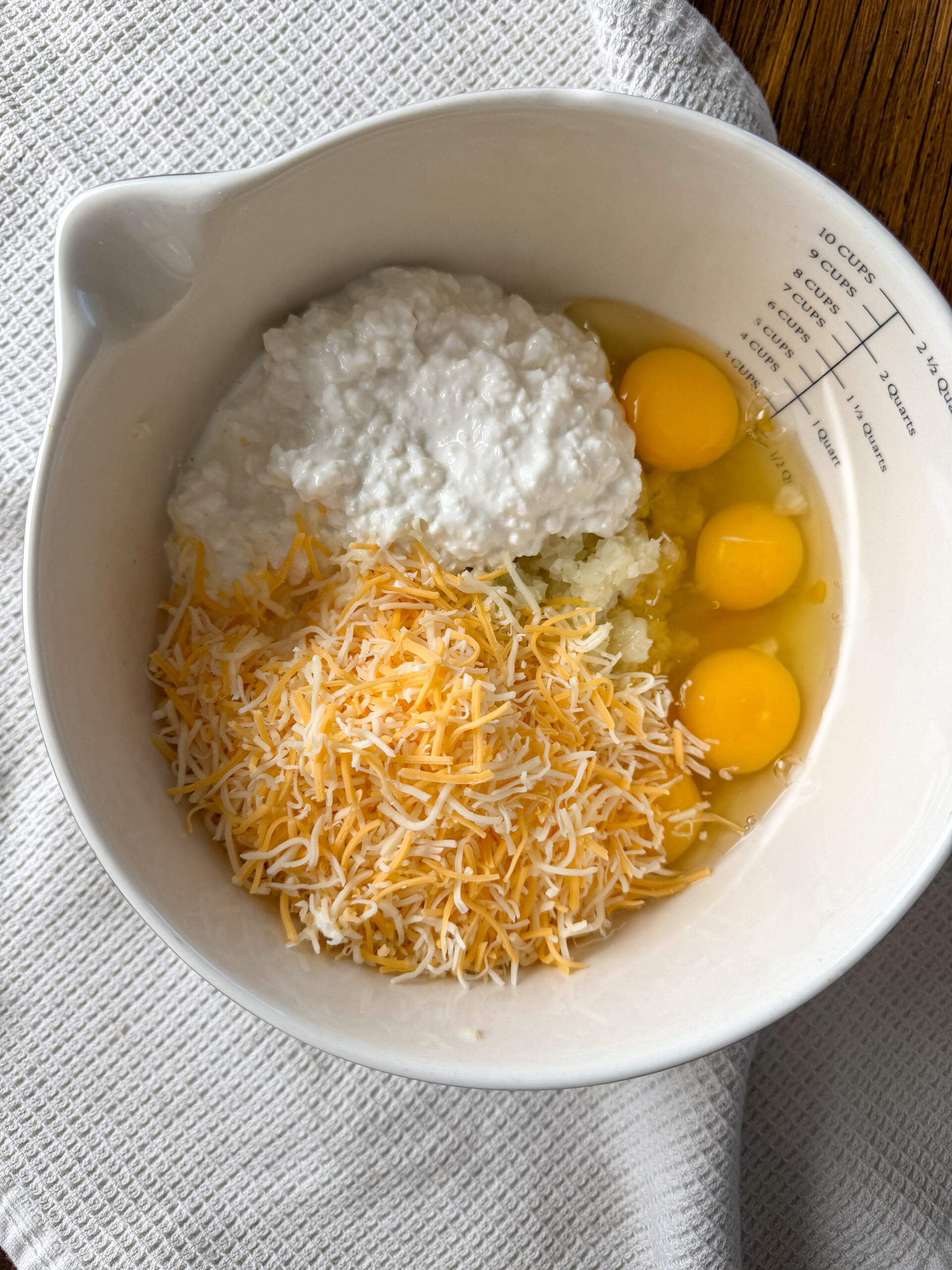 mixing the Cheesy Cauliflower Frittata Bars (easy, toddler-friendly egg bake)