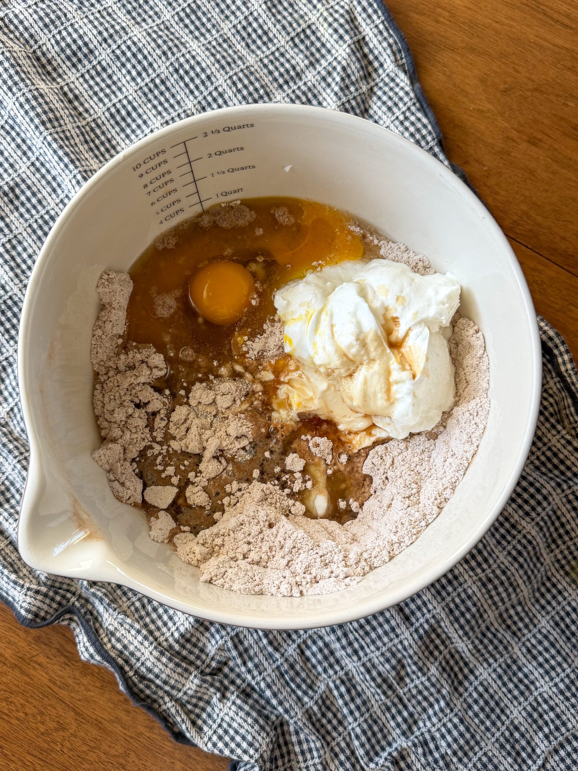 mixing the cinnamon muffin ingredients in a bowl