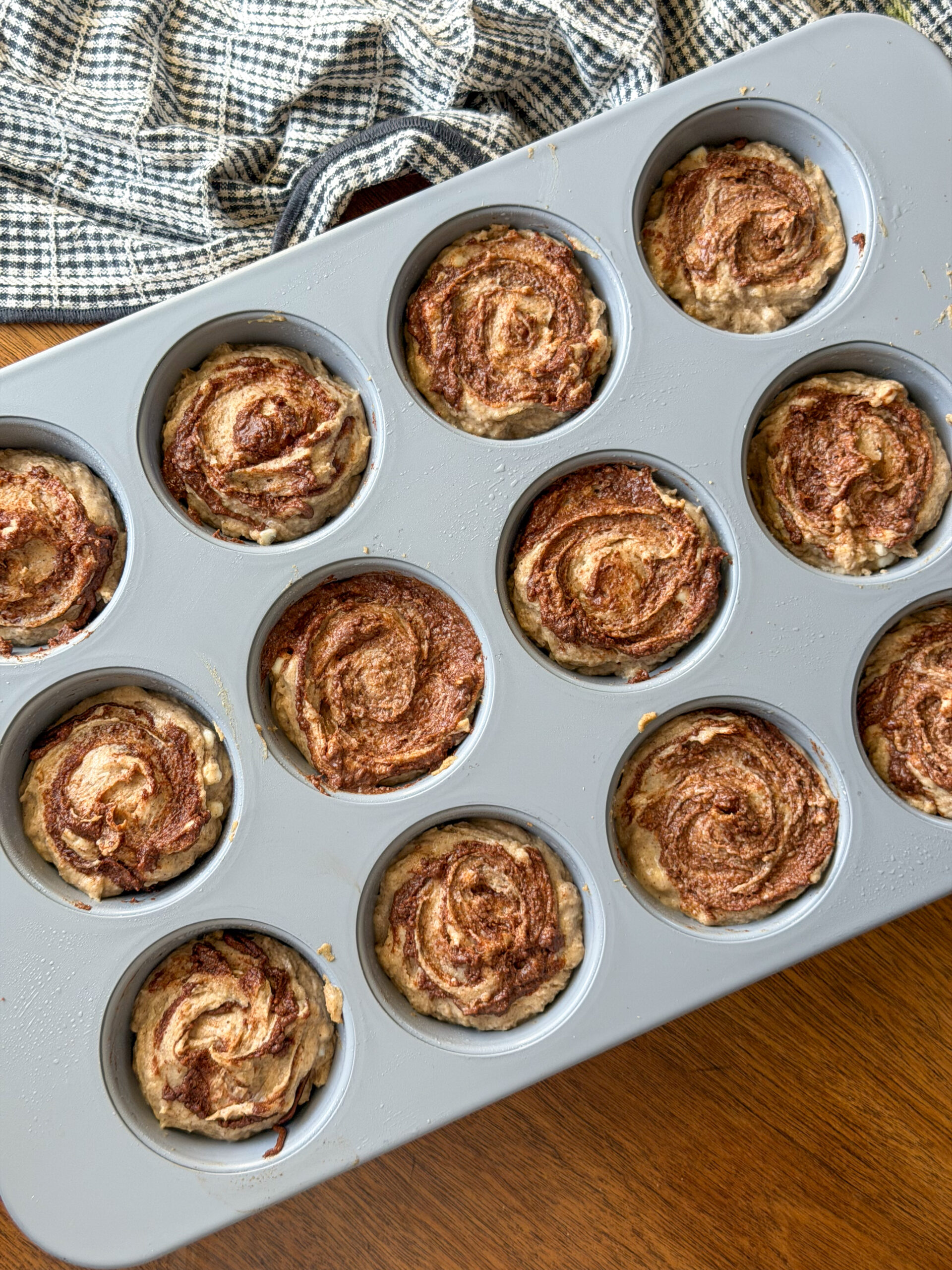 Healthy Cinnamon Roll Muffins in muffin tin (low sugar, easy to make!)