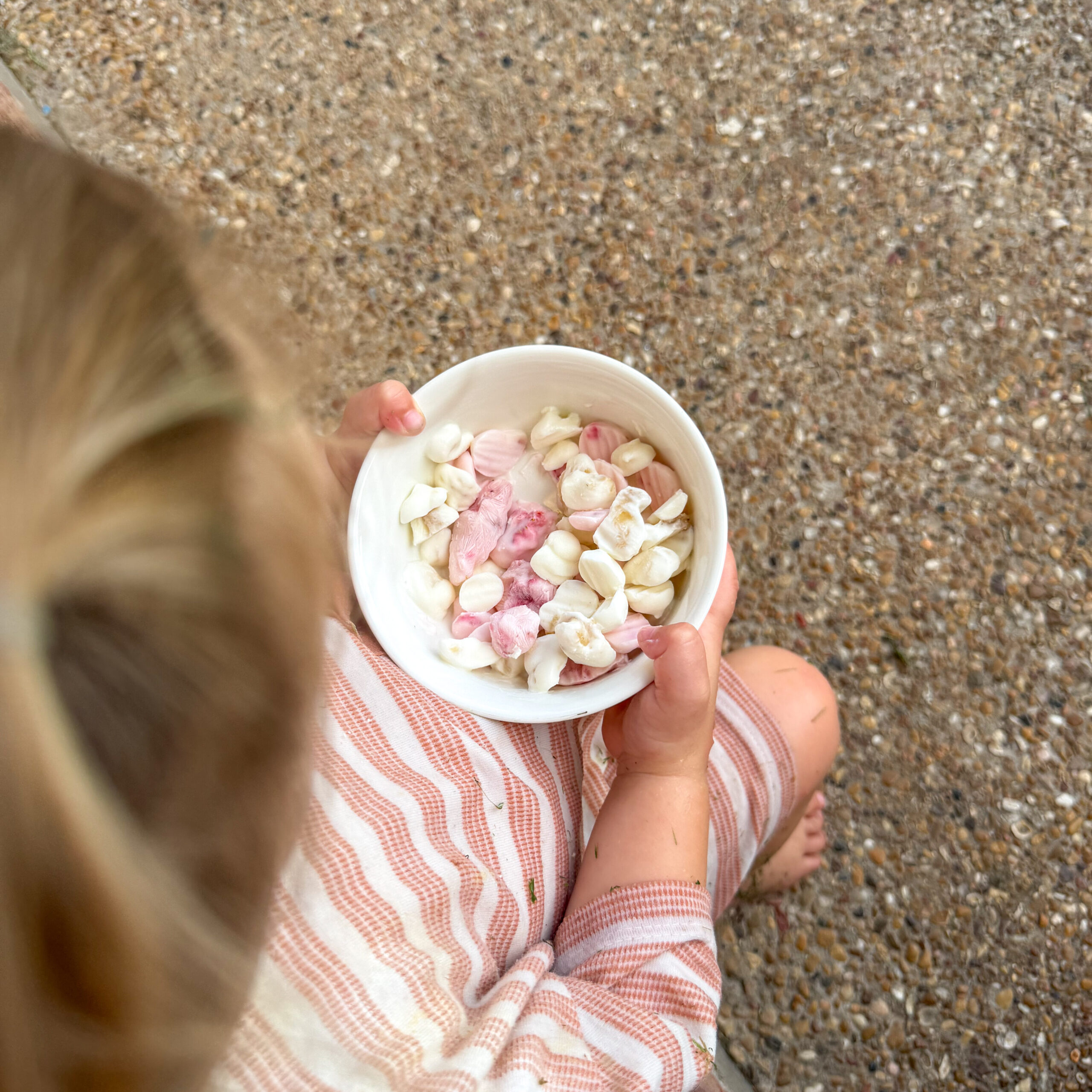 toddler with yogurt snack