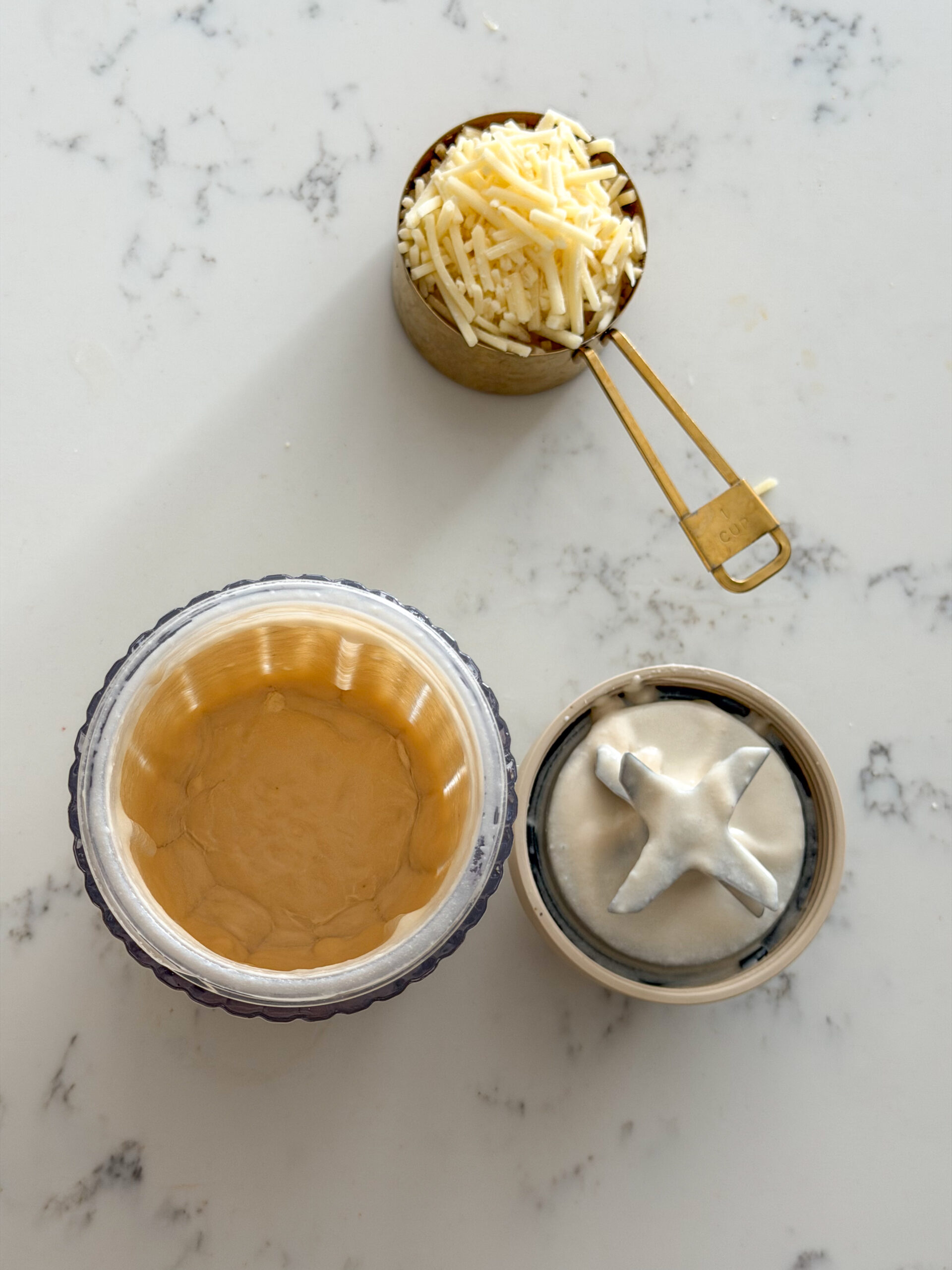 blending the white bean cheese sauce for mac and cheese