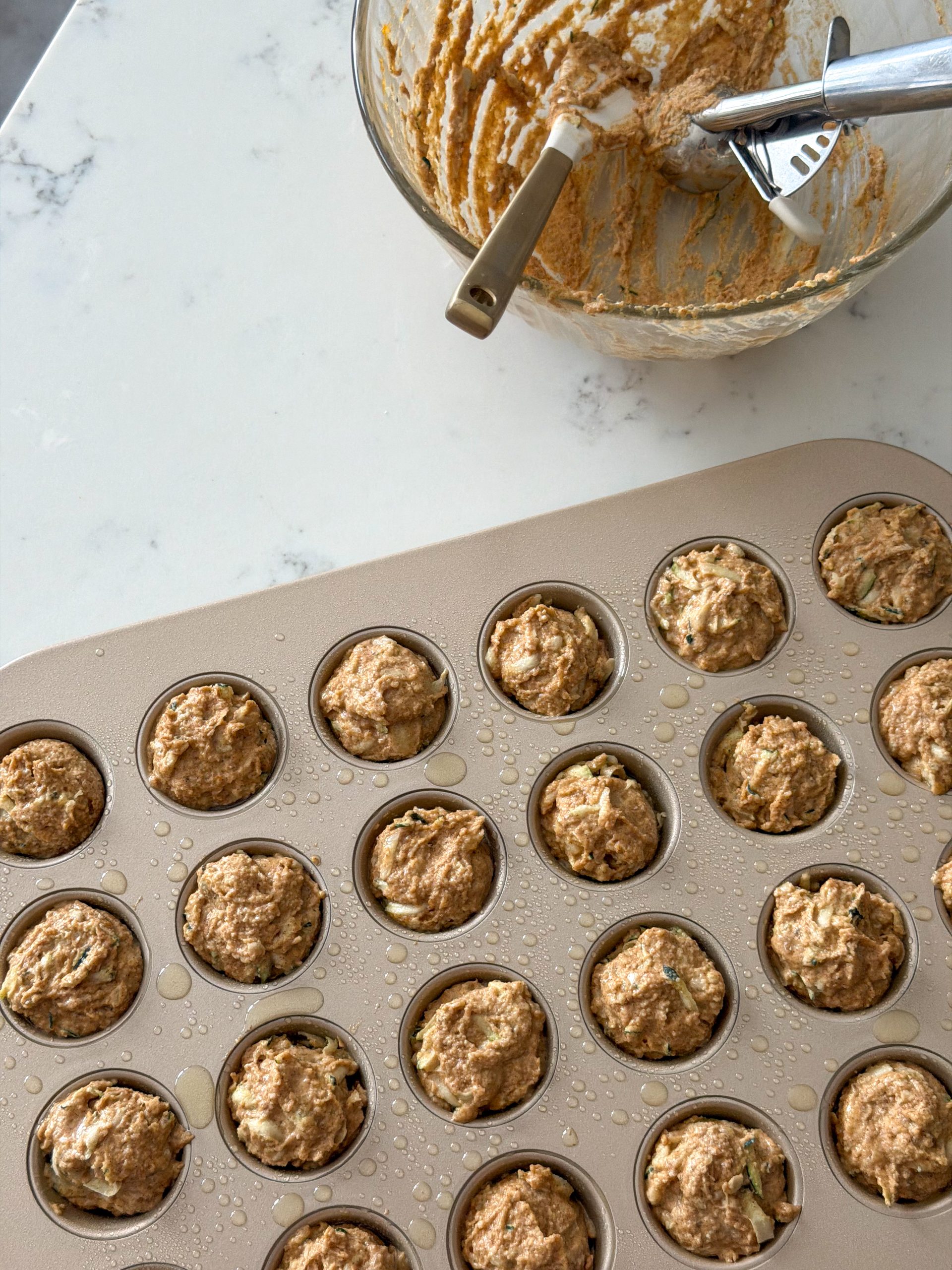 dividing muffins into the pan